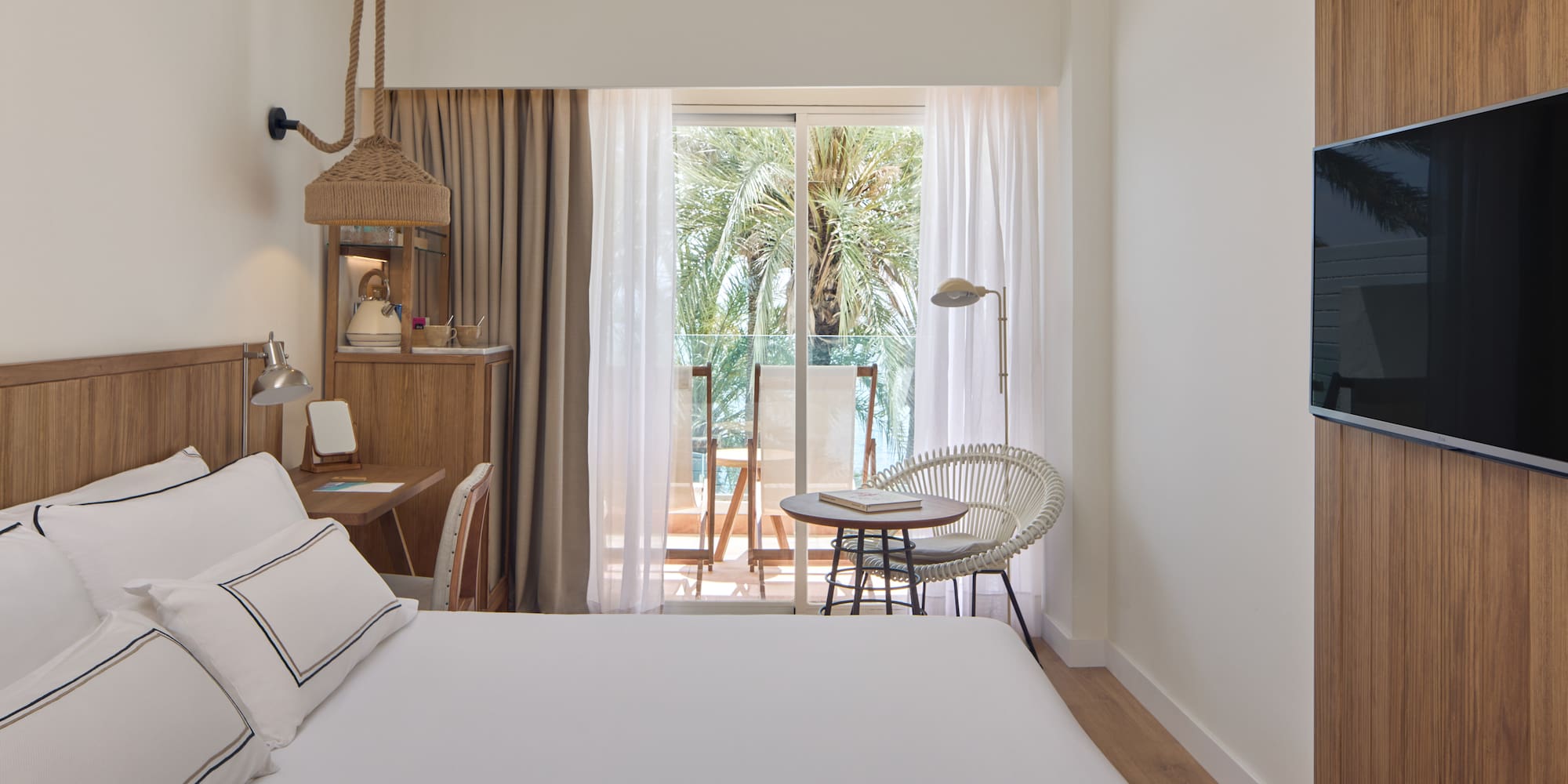 a bedroom with a bed and a chair