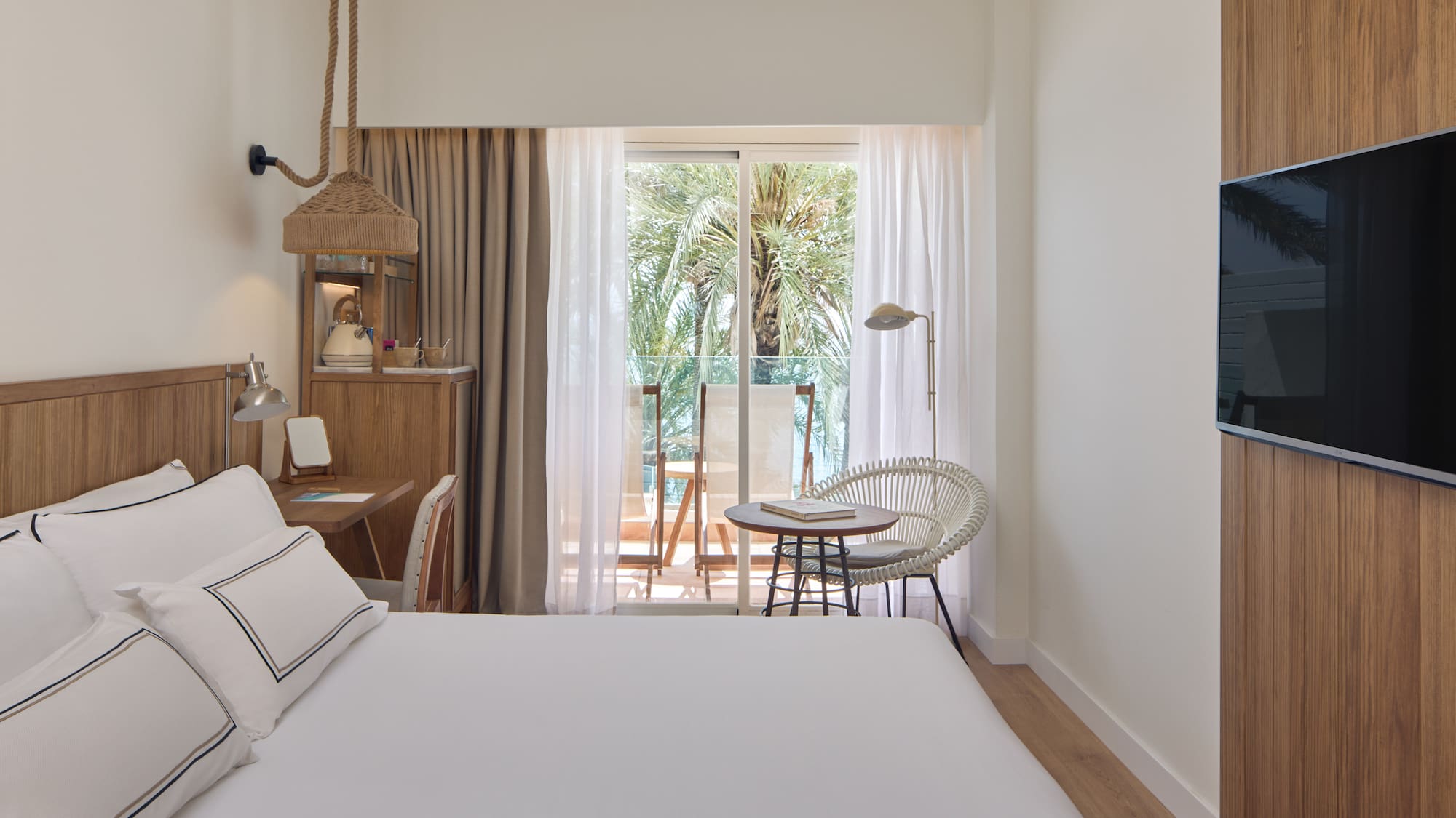 a bedroom with a bed and a chair