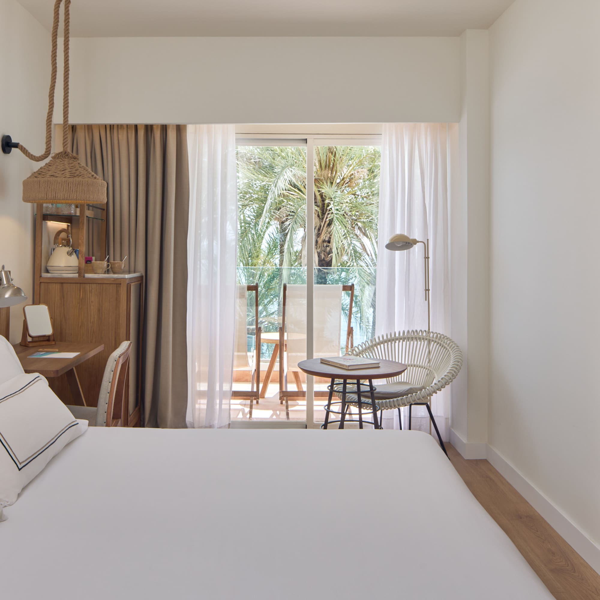 a bedroom with a bed and a chair