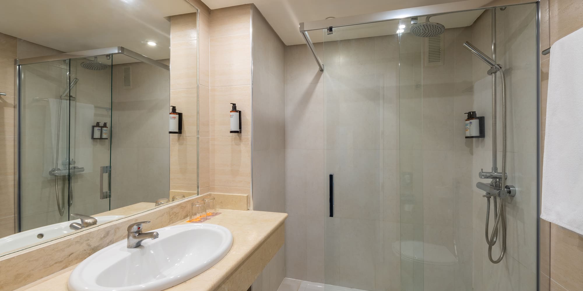 a bathroom with a shower and sink