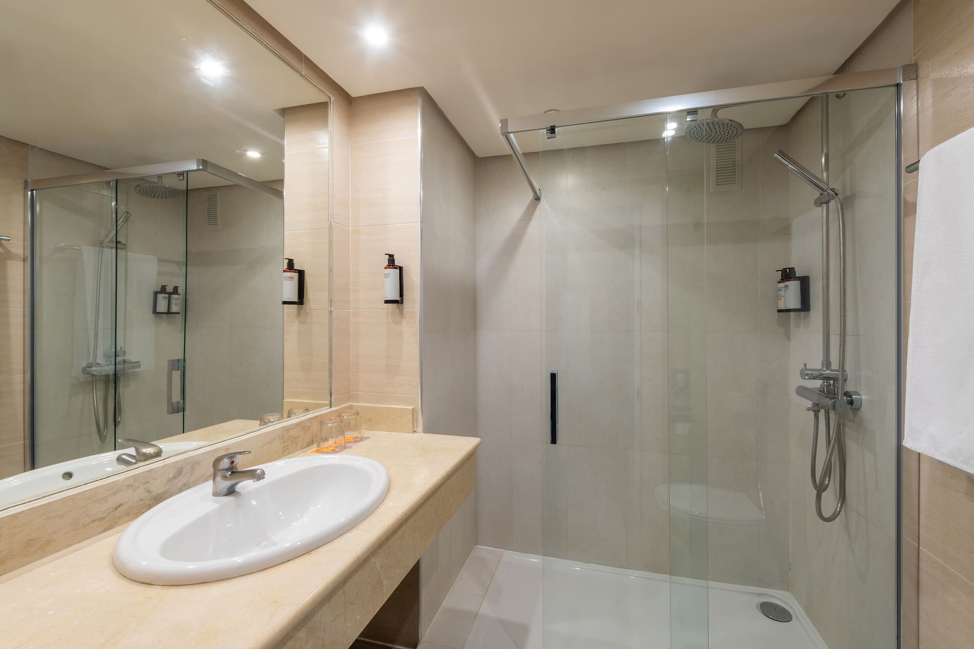 a bathroom with a shower and sink