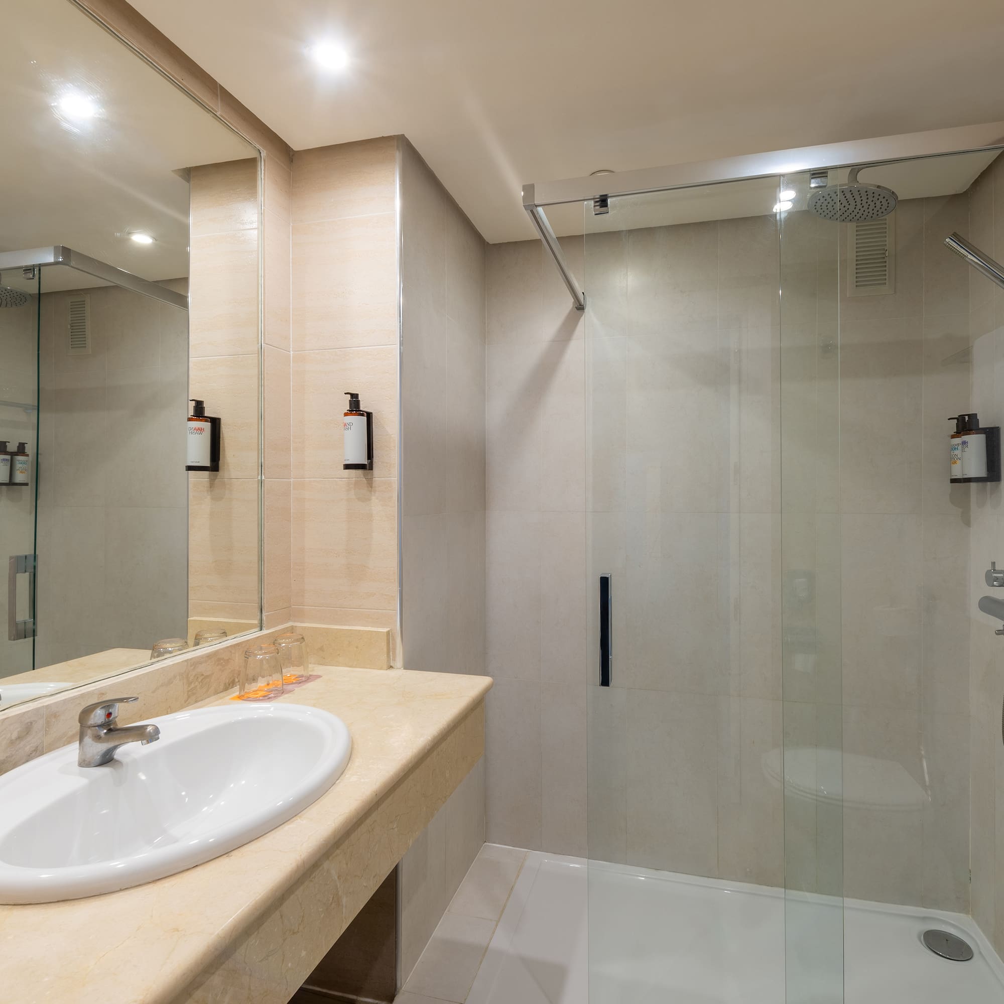 a bathroom with a shower and sink