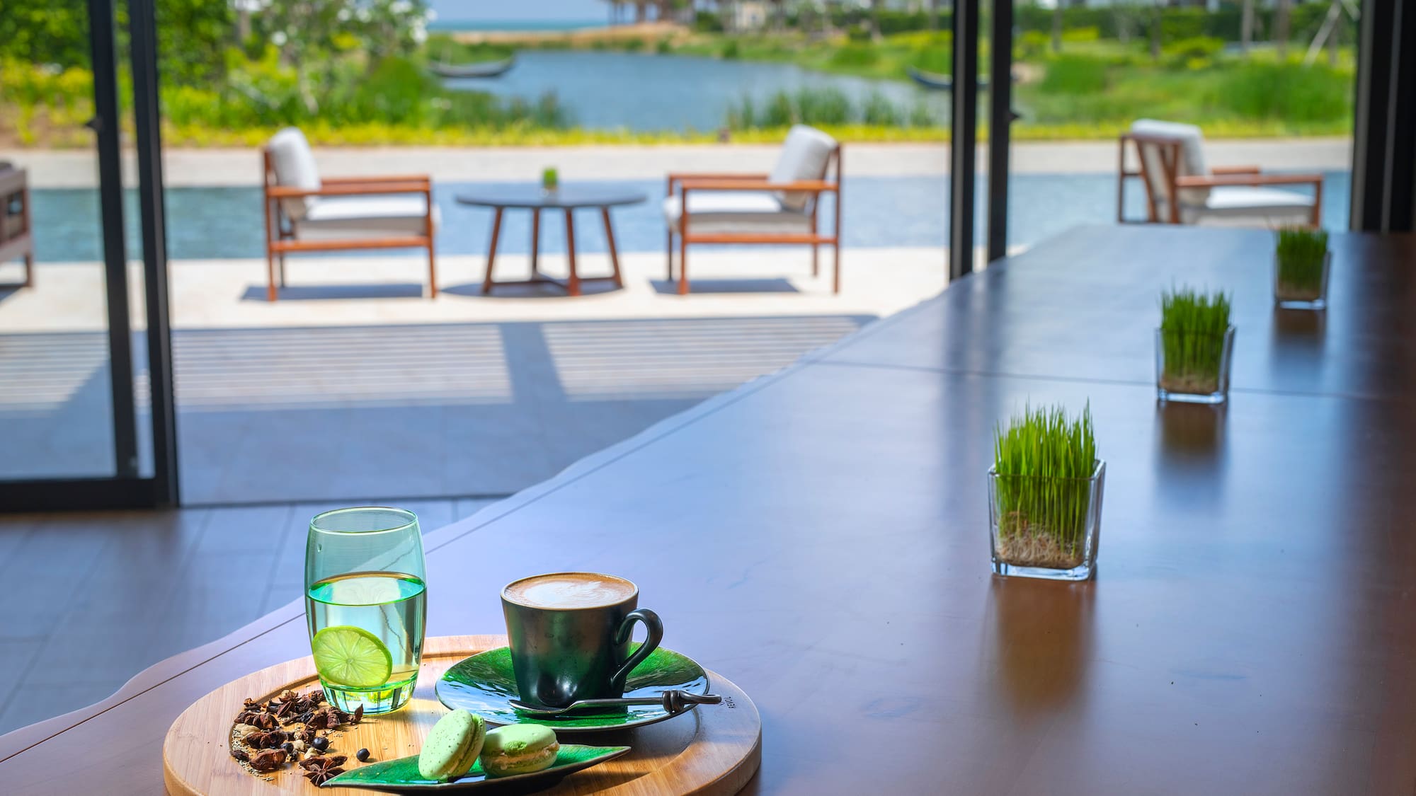 a table with a cup of coffee and a glass of water