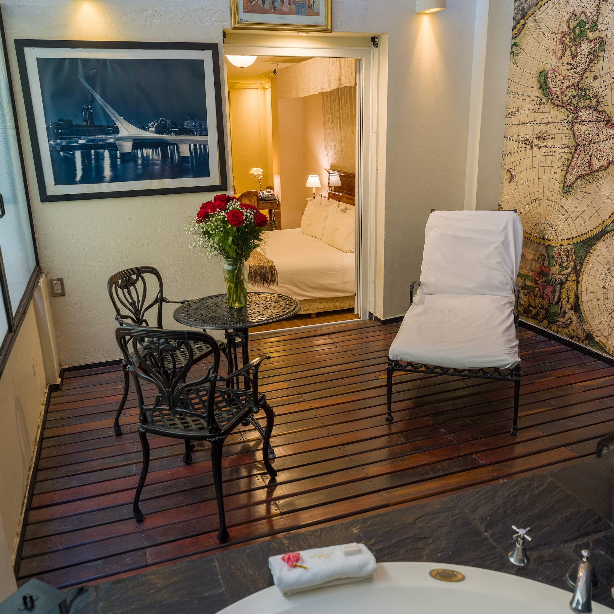 a room with a bathtub and a chair