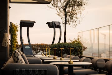 a group of chairs and tables on a patio