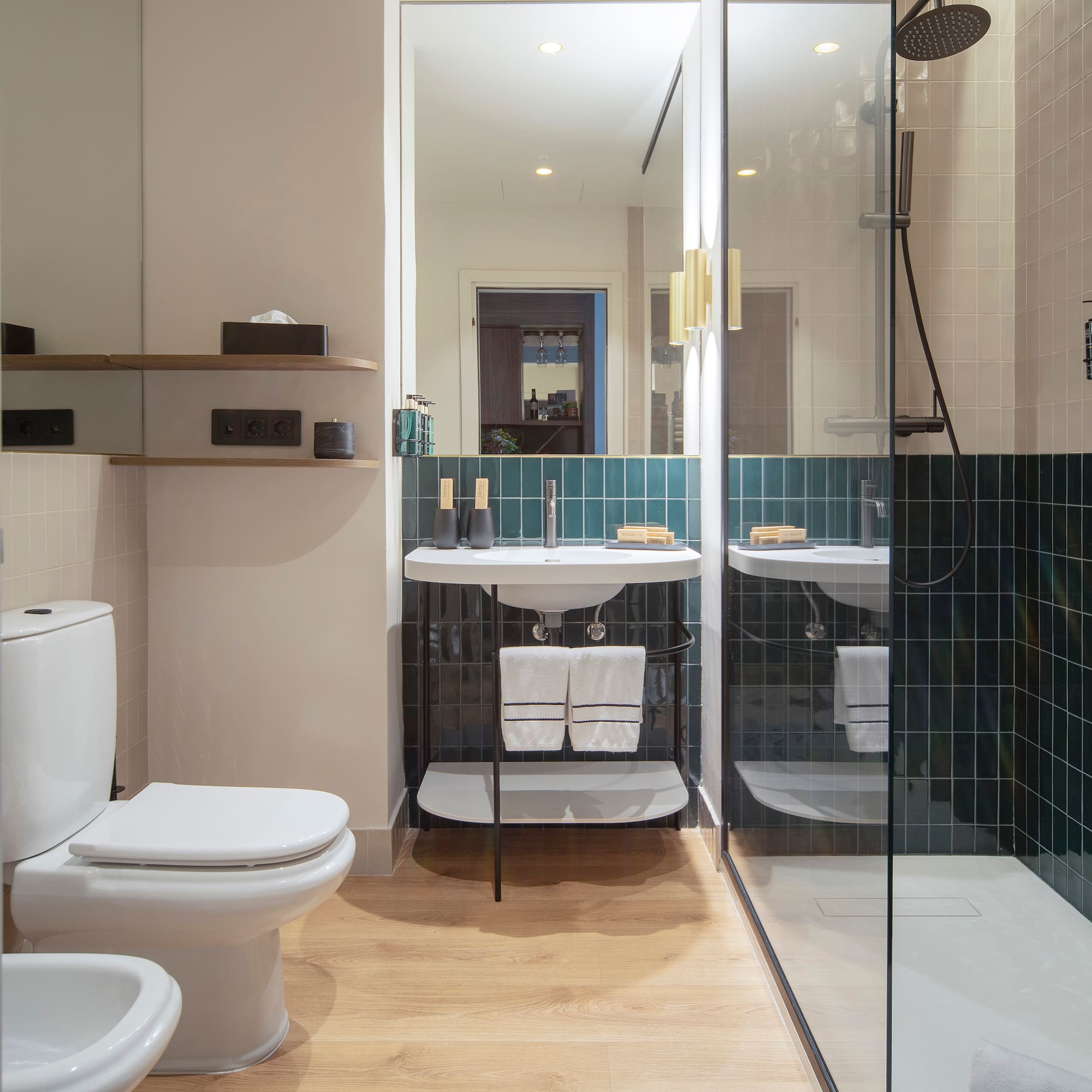 a bathroom with a glass shower door