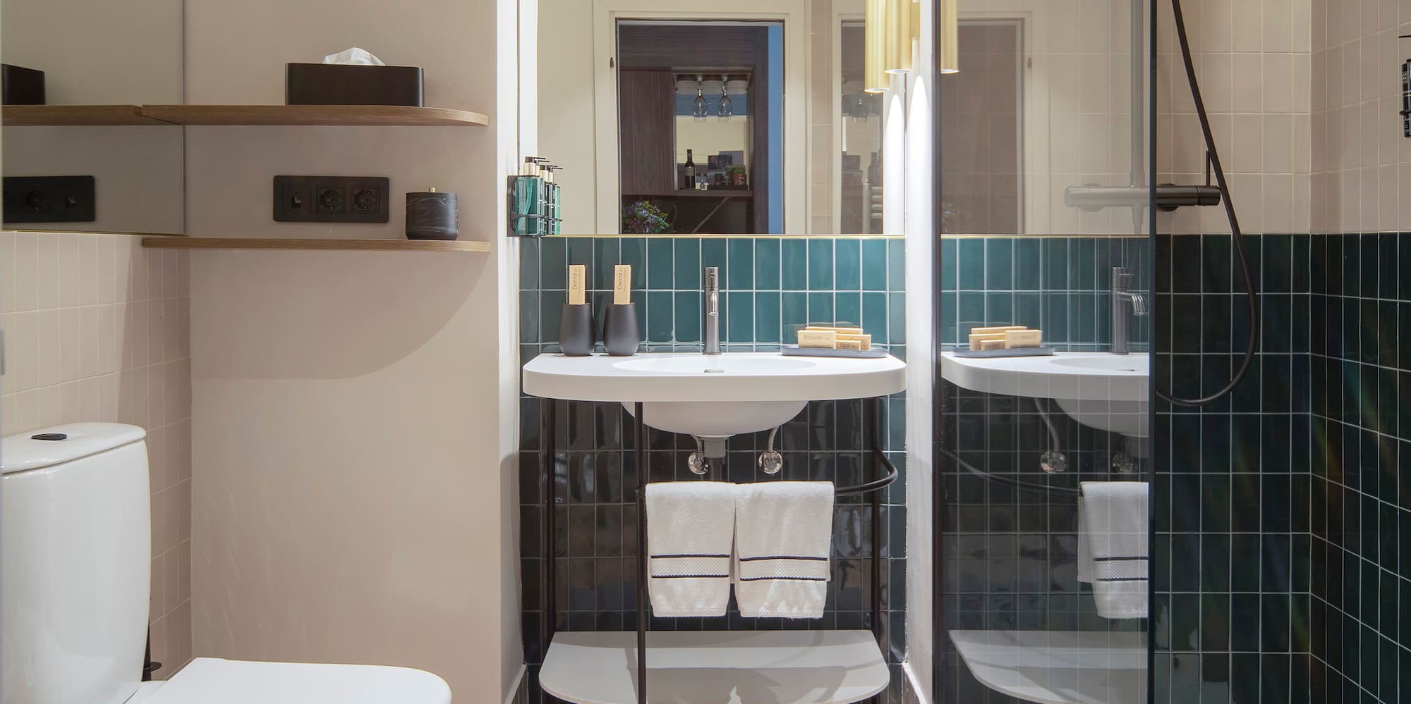 a bathroom with a glass shower door