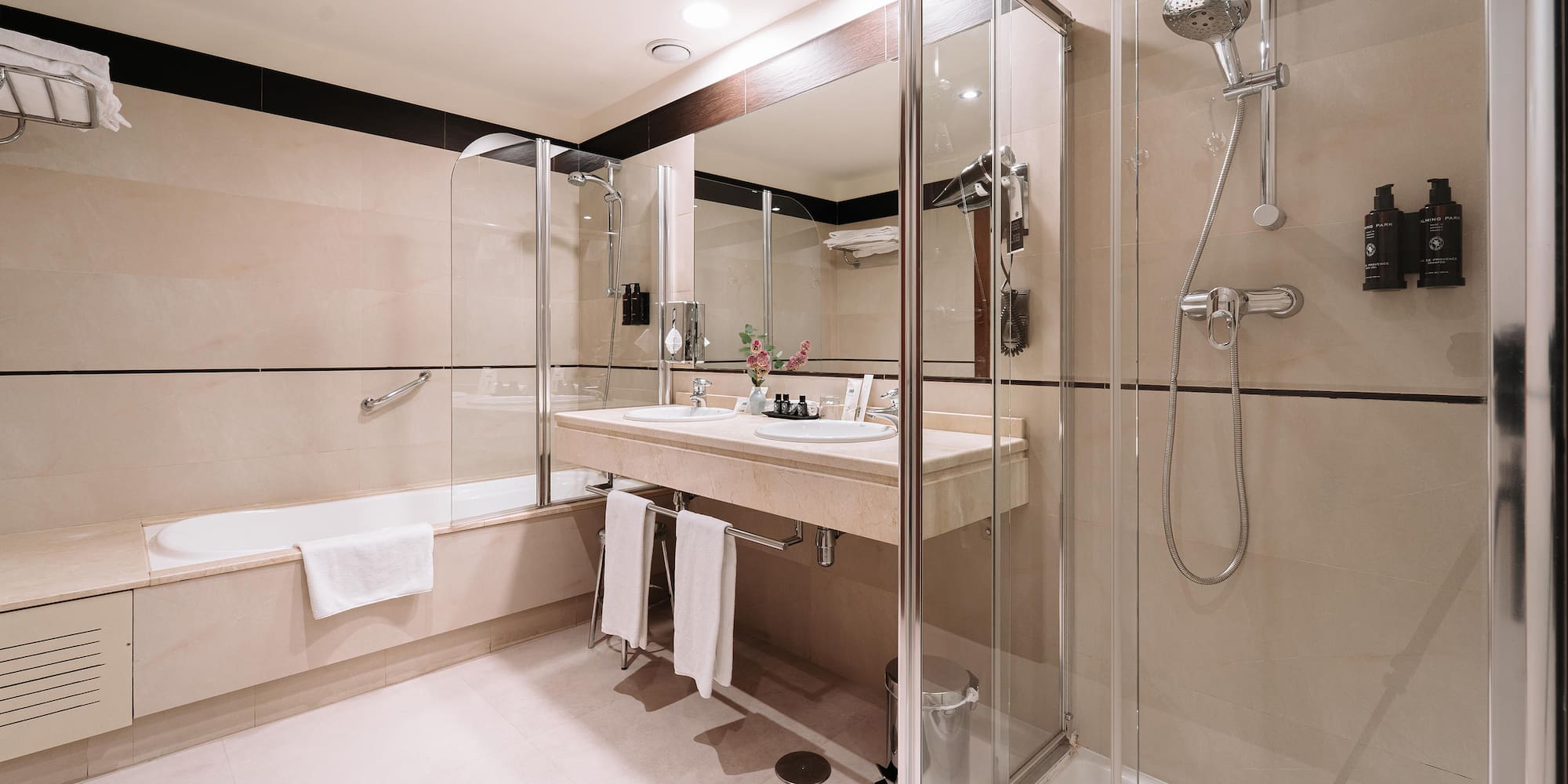 a bathroom with a shower and sink