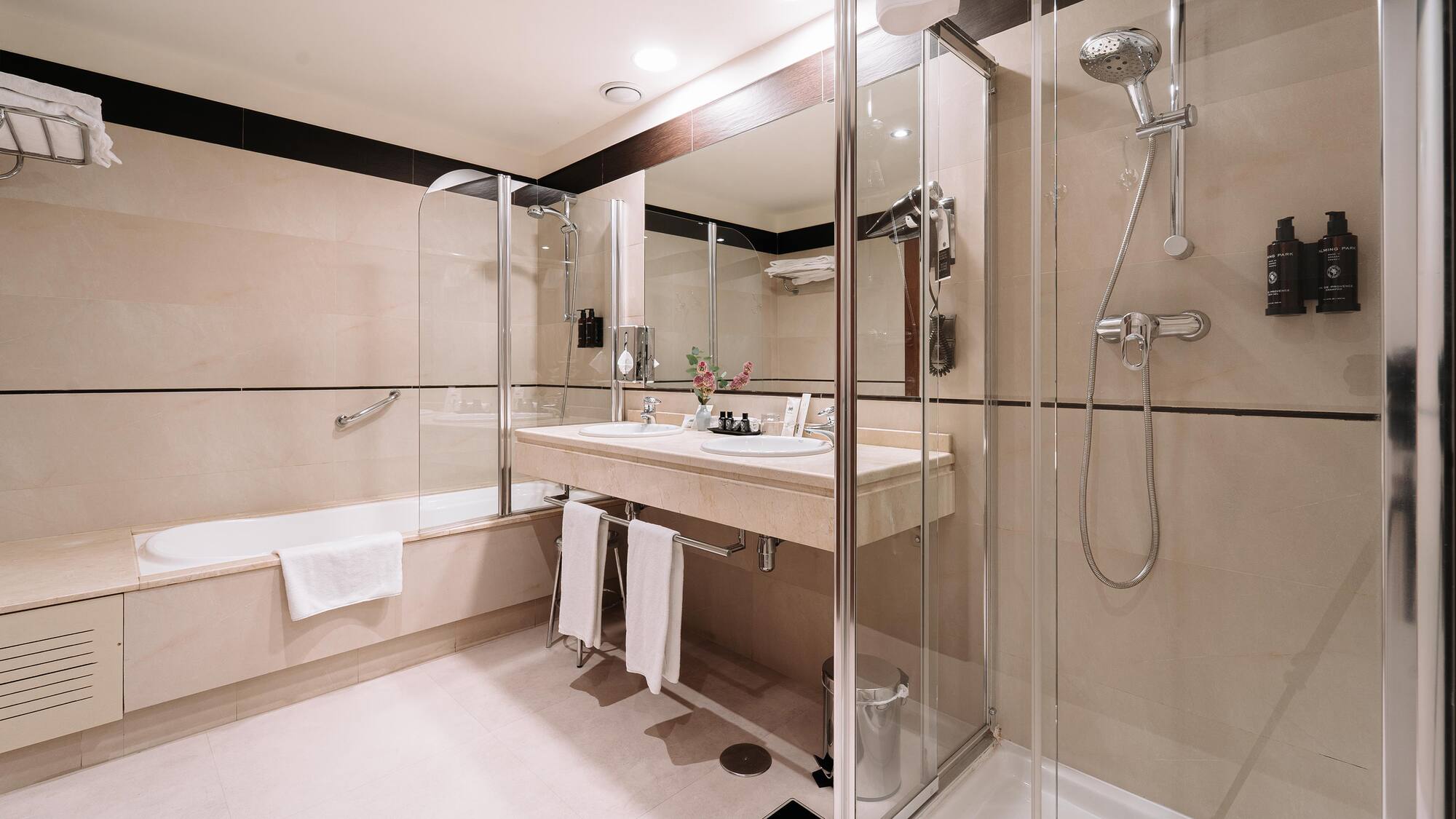 a bathroom with a shower and sink