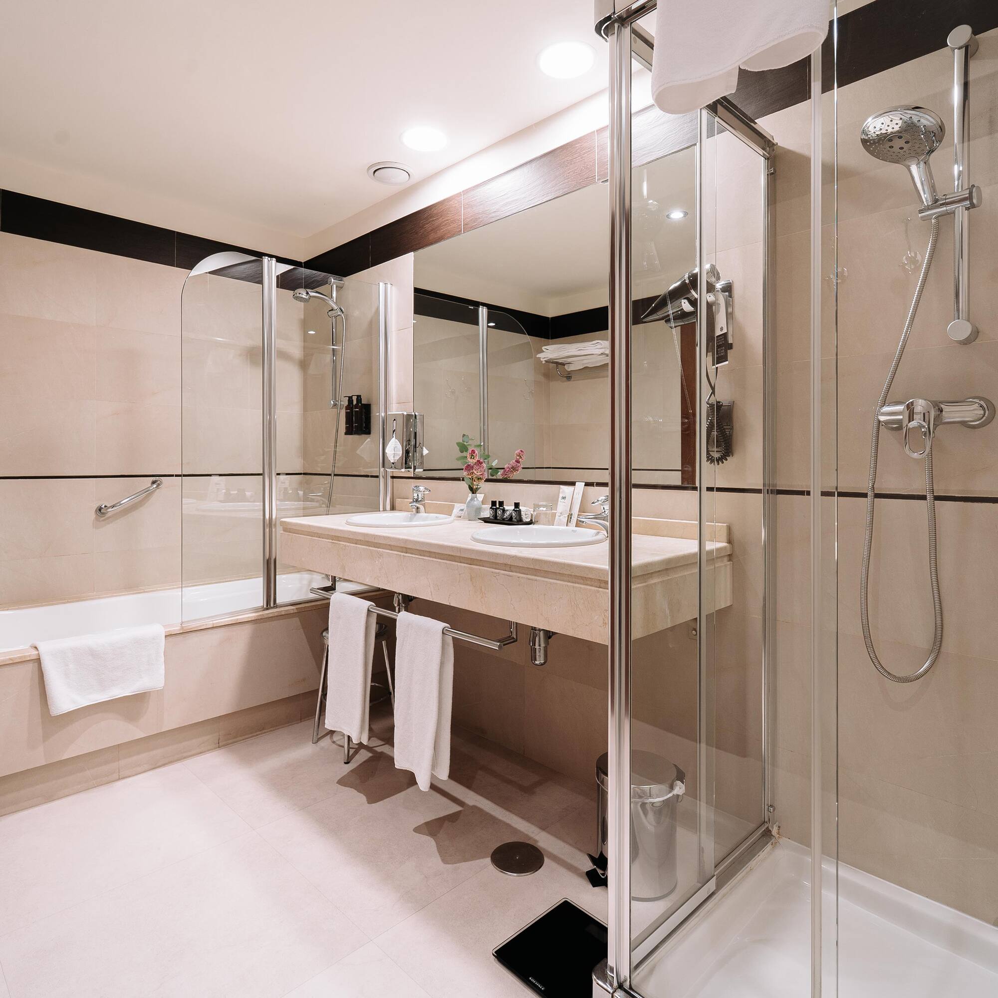 a bathroom with a shower and sink