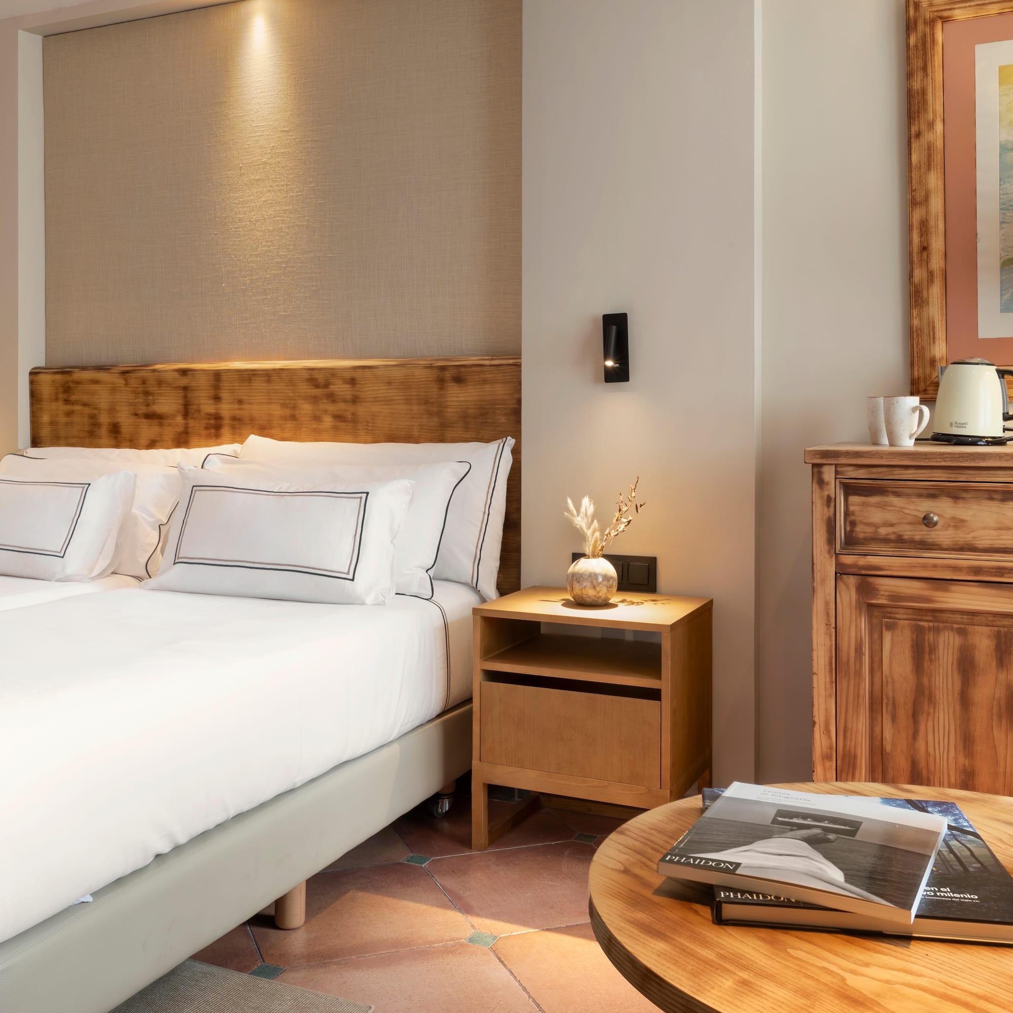 a bedroom with a bed and a table