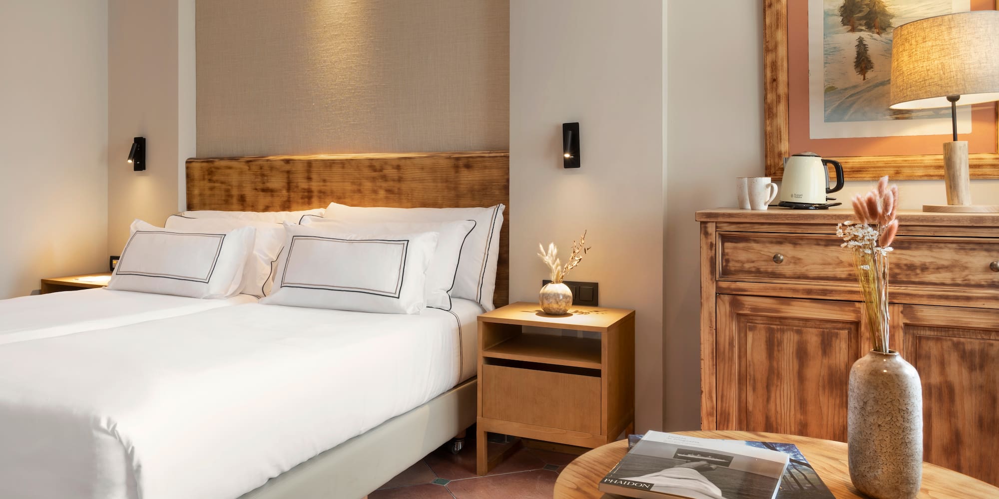 a bedroom with a bed and a table