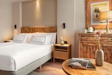 a bedroom with a bed and a table