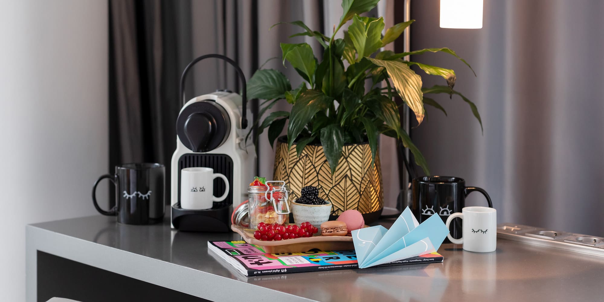 a table with a plant and a tray on it