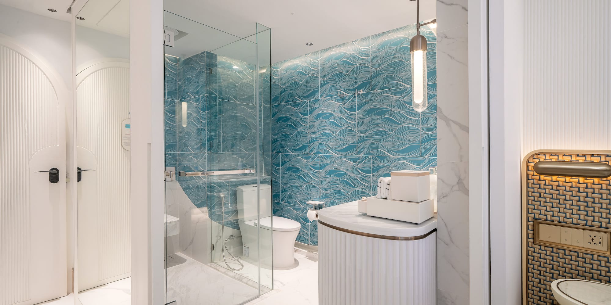 a bathroom with a blue wall and a toilet