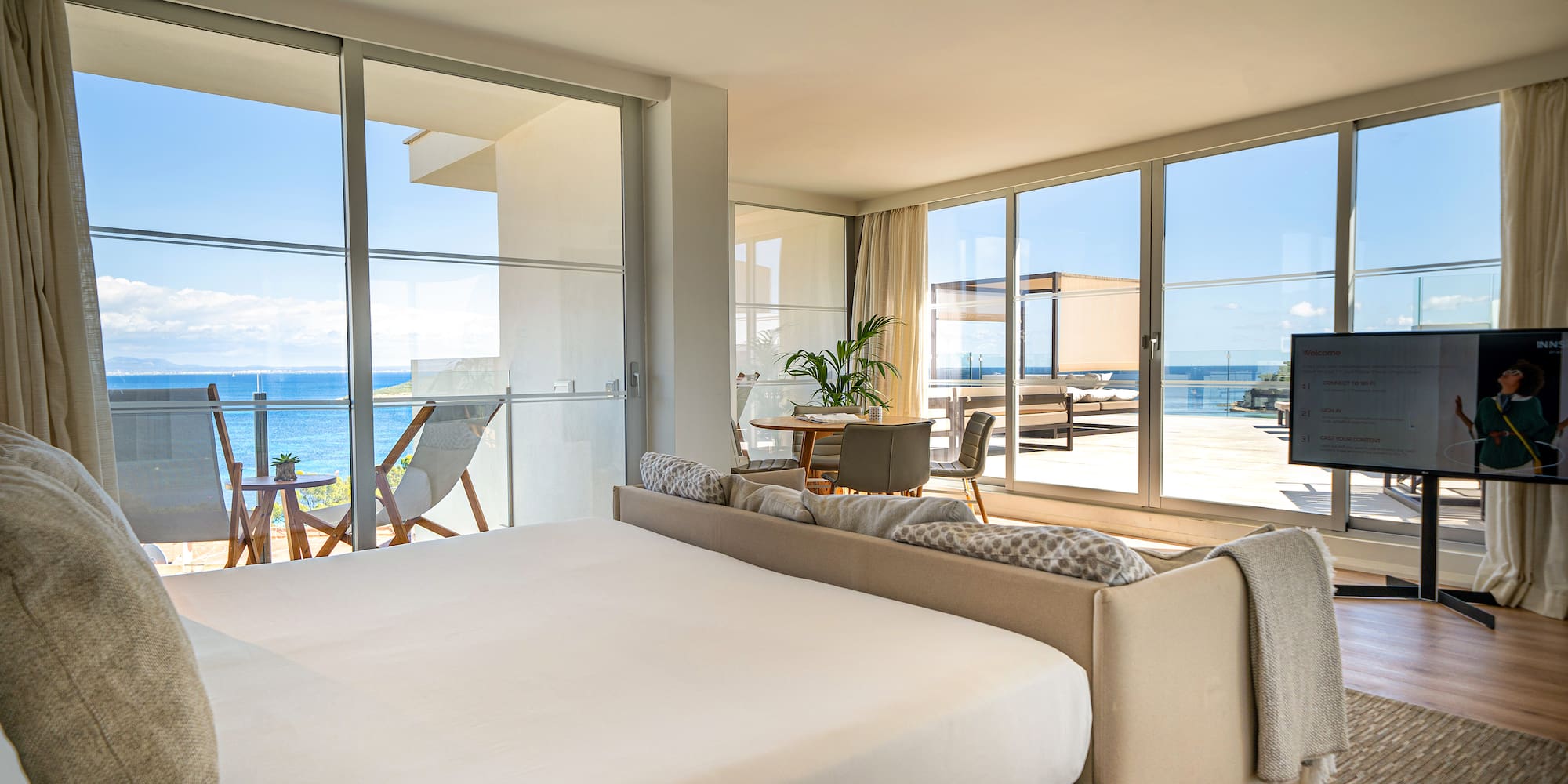 a bedroom with a large bed and a large window