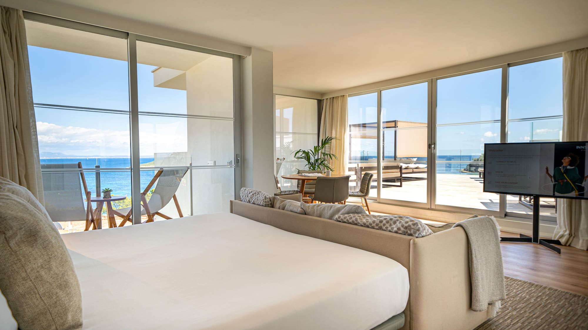 a bedroom with a large bed and a large window