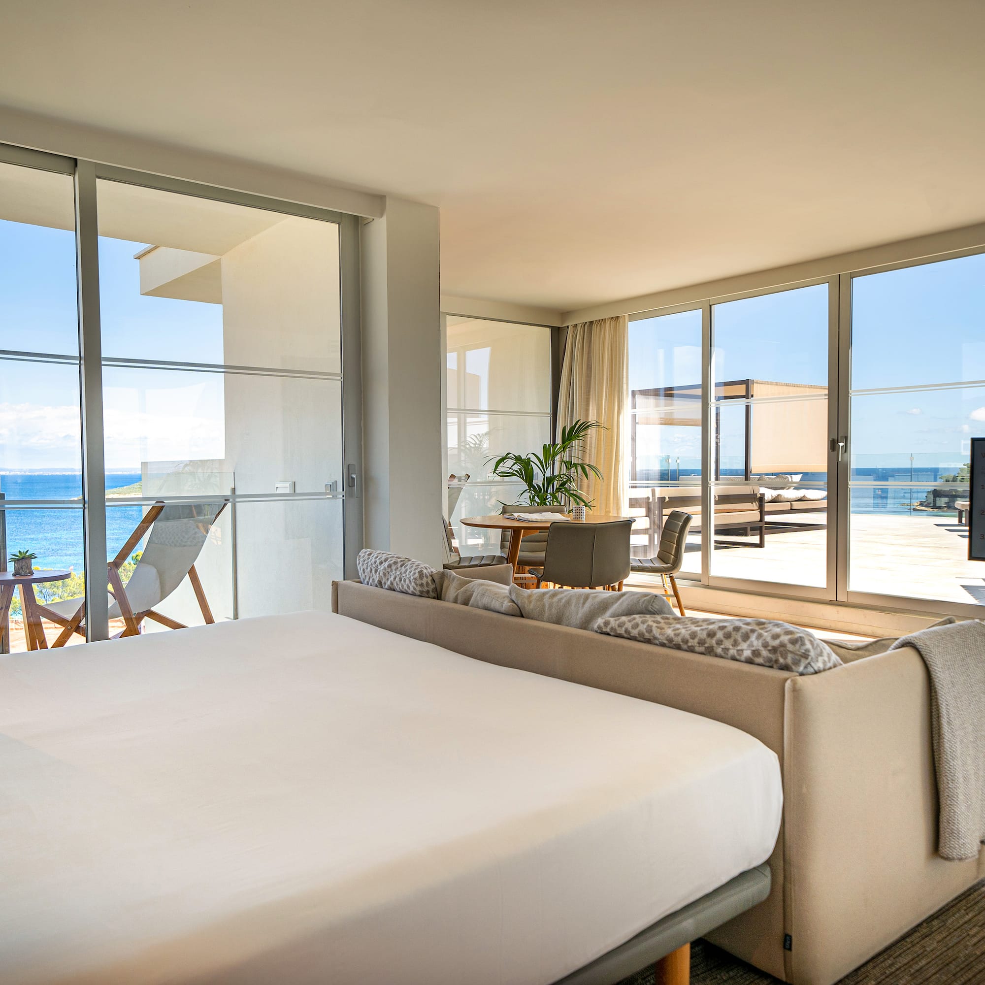 a bedroom with a large bed and a large window