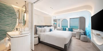 a room with a bed and a mirror