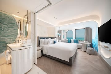 a room with a bed and a mirror