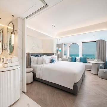 a room with a bed and a mirror