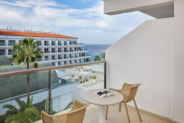 a balcony with chairs and a book