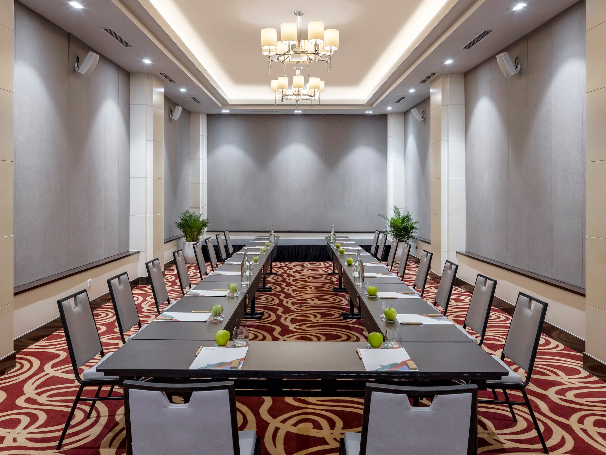 a room with long tables and chairs