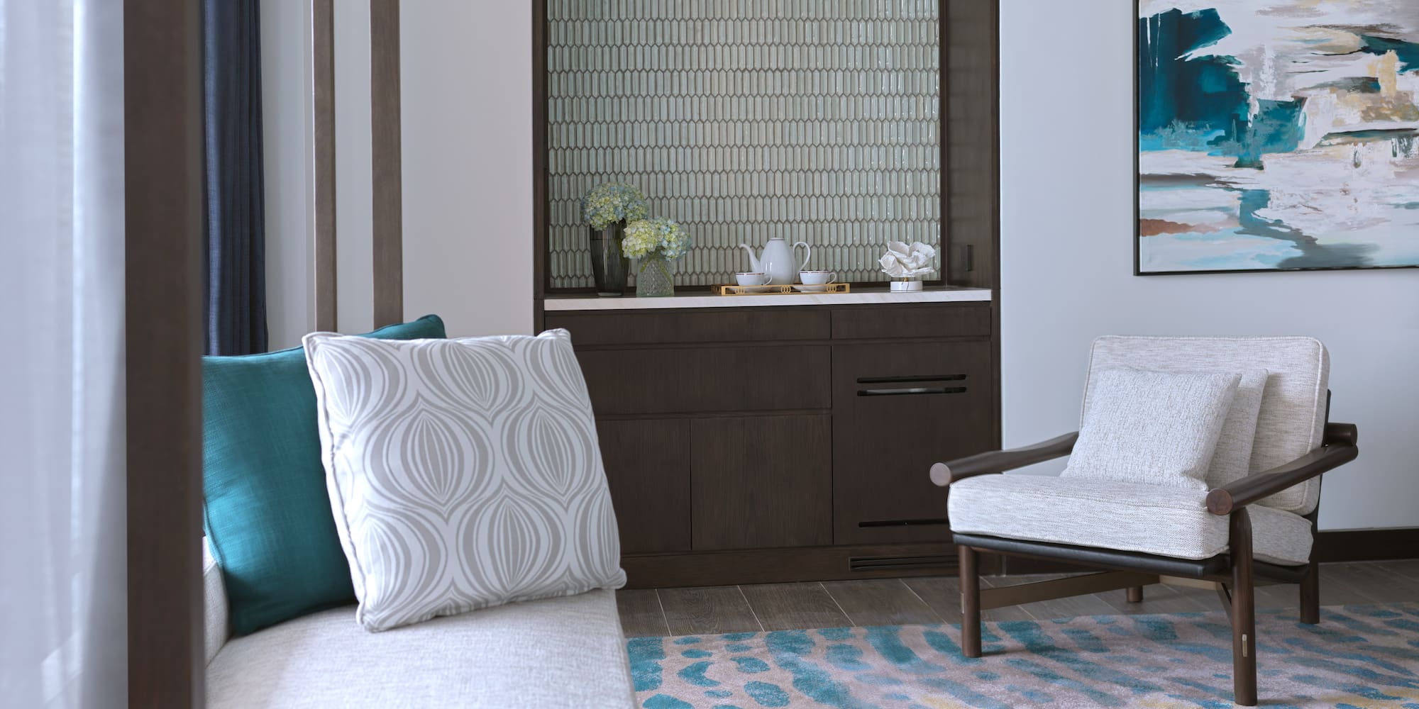 a room with a couch and a rug