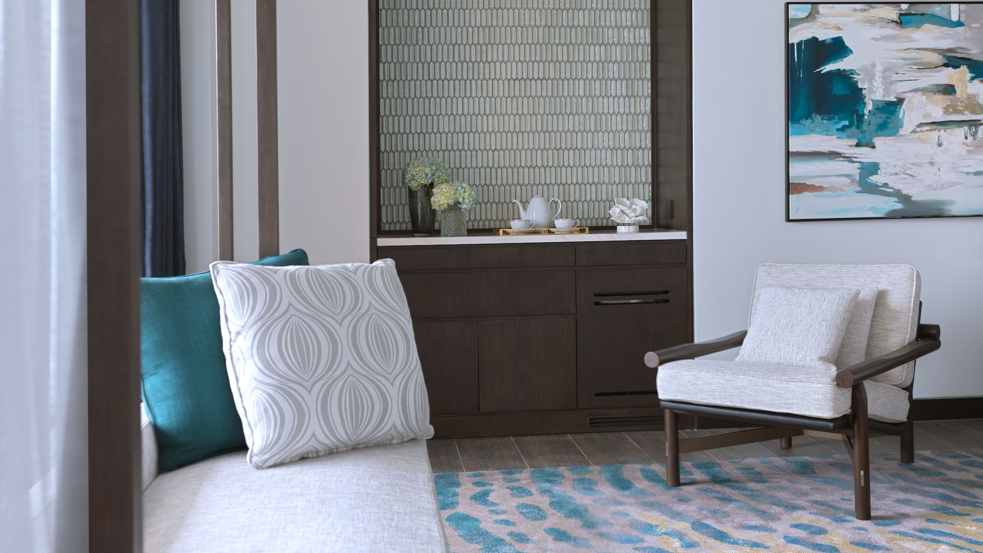 a room with a couch and a rug