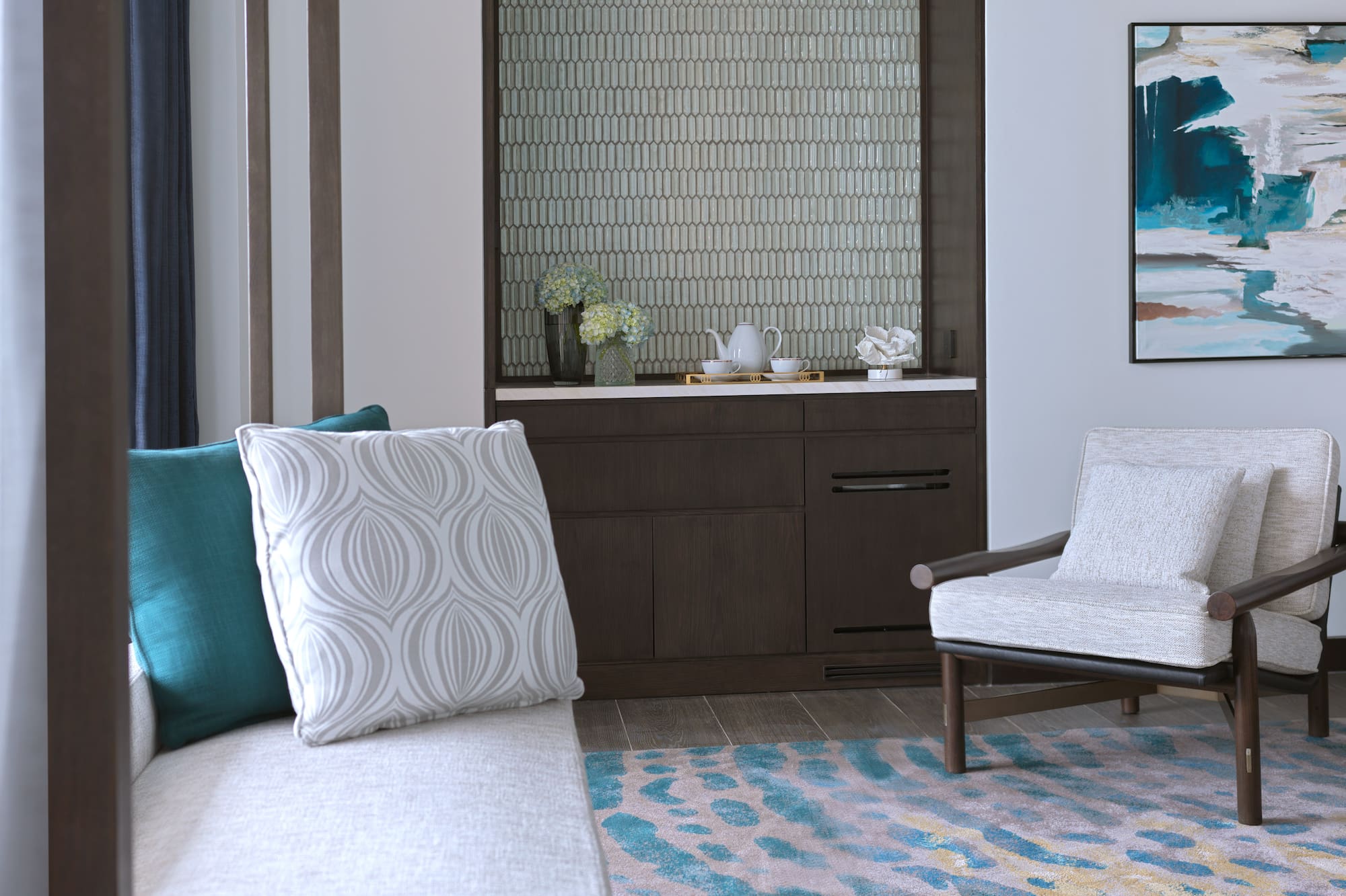 a room with a couch and a rug