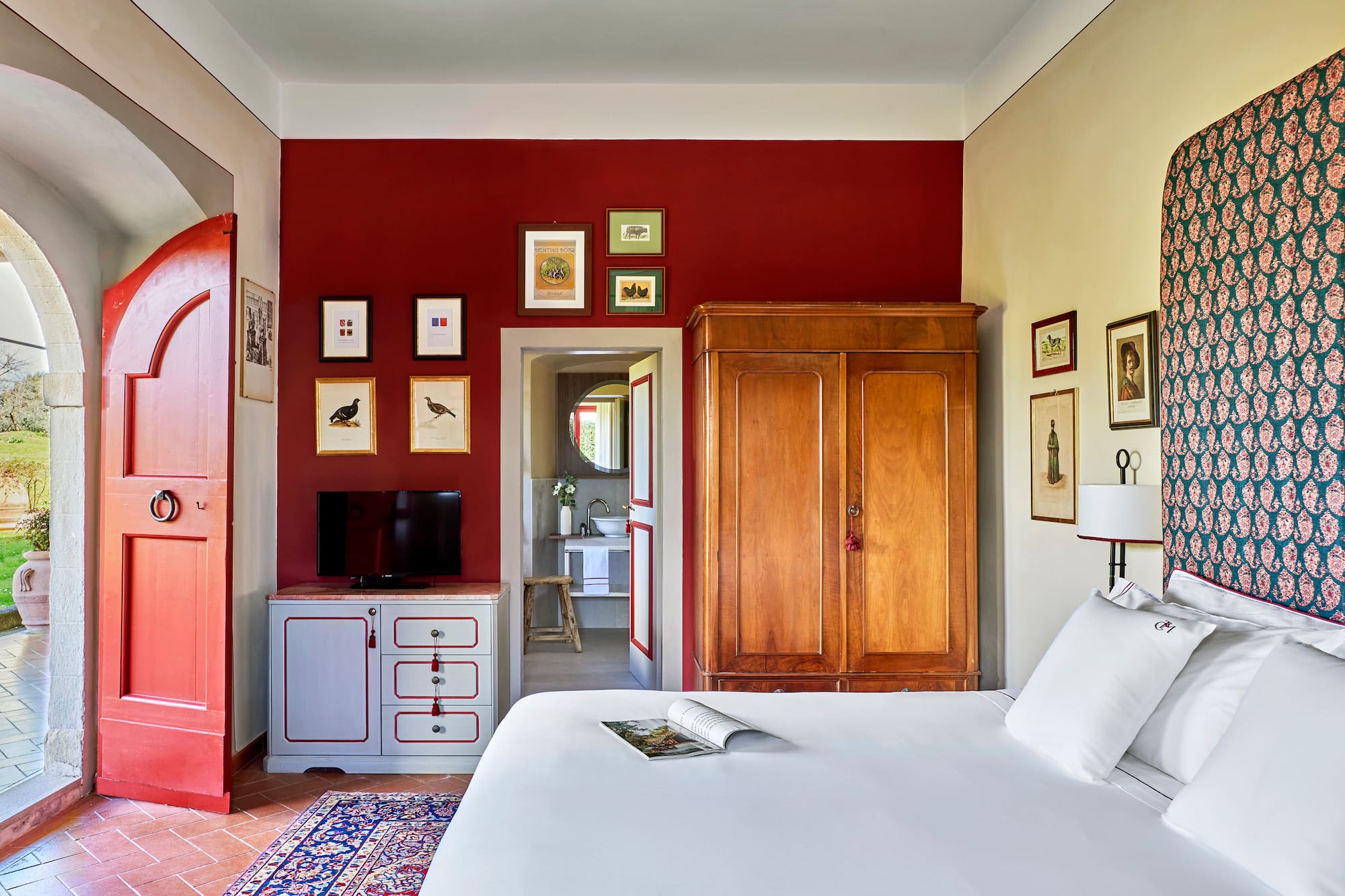 a bedroom with a bed and a cabinet