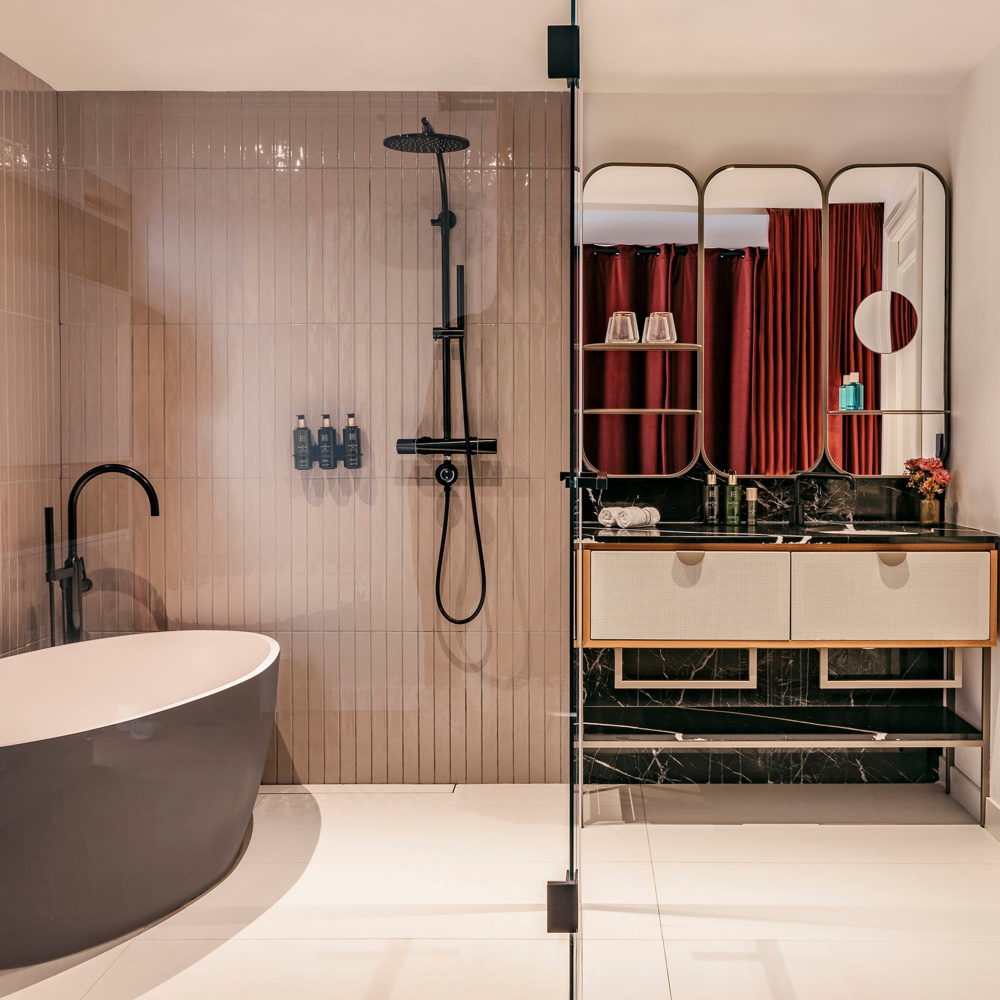 a bathroom with a tub and shower