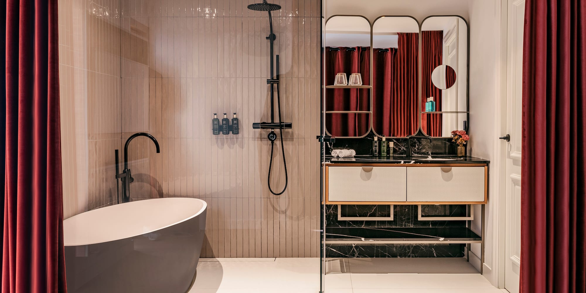 a bathroom with a tub and shower