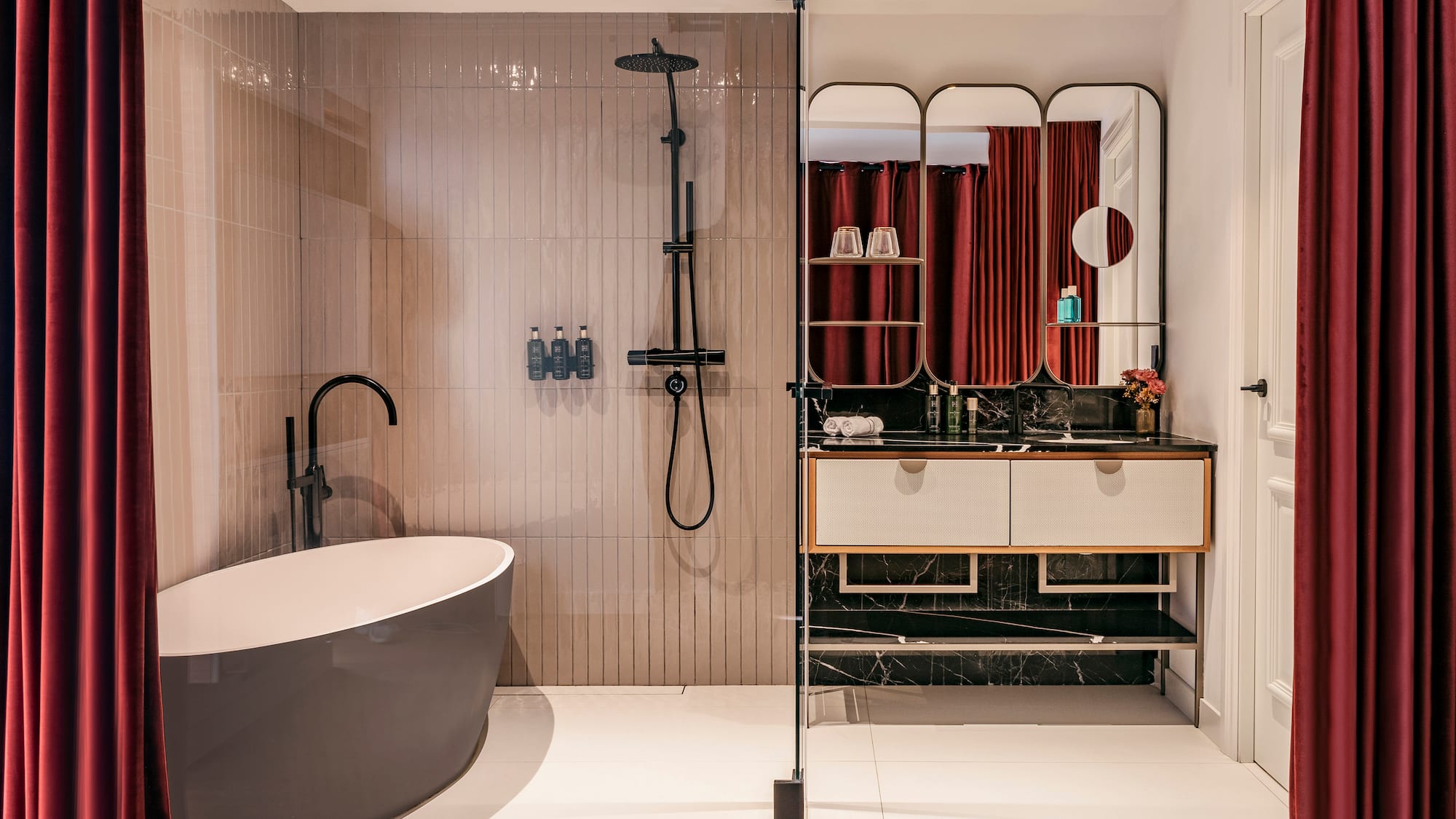 a bathroom with a tub and shower