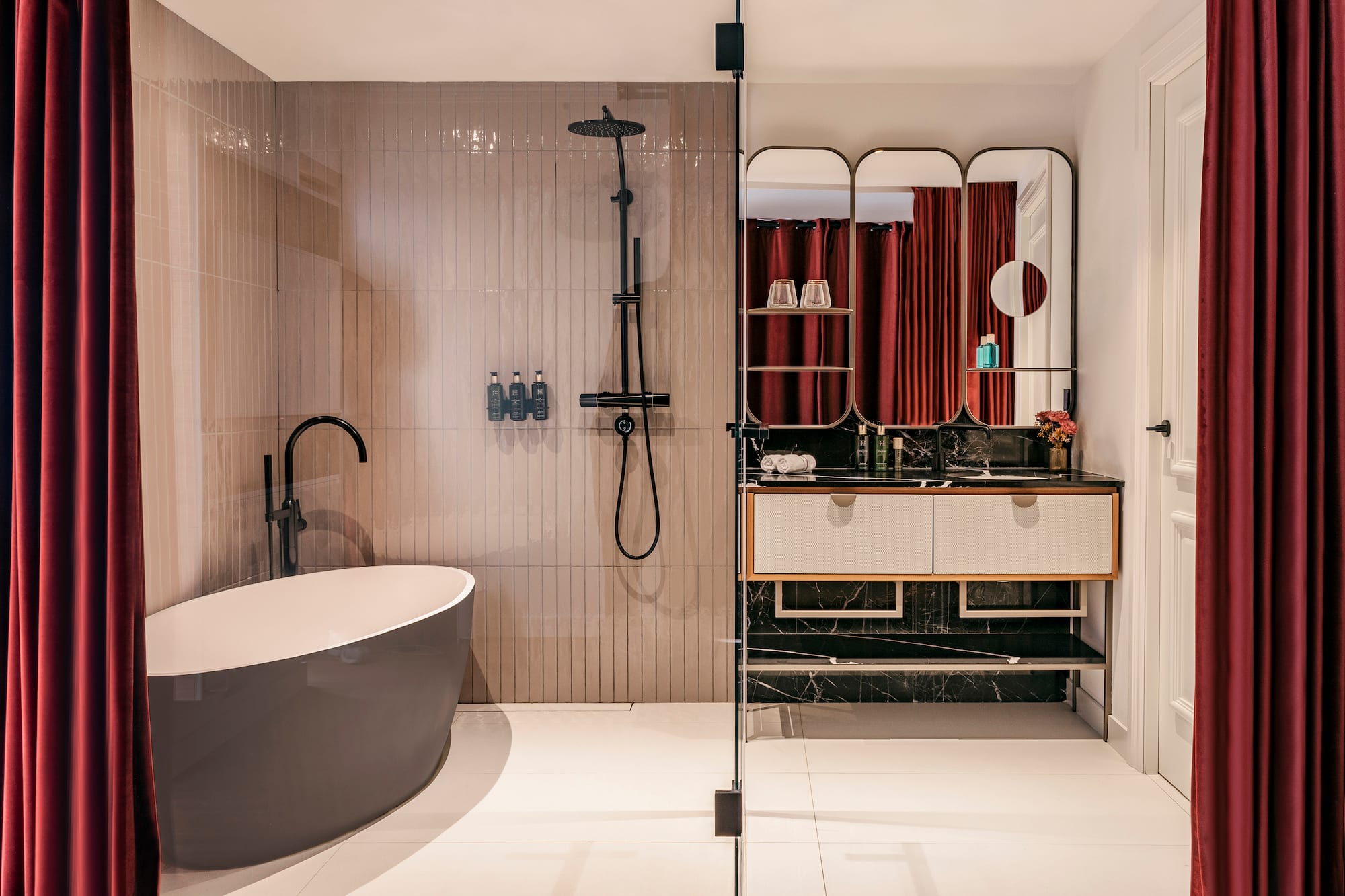 a bathroom with a tub and shower