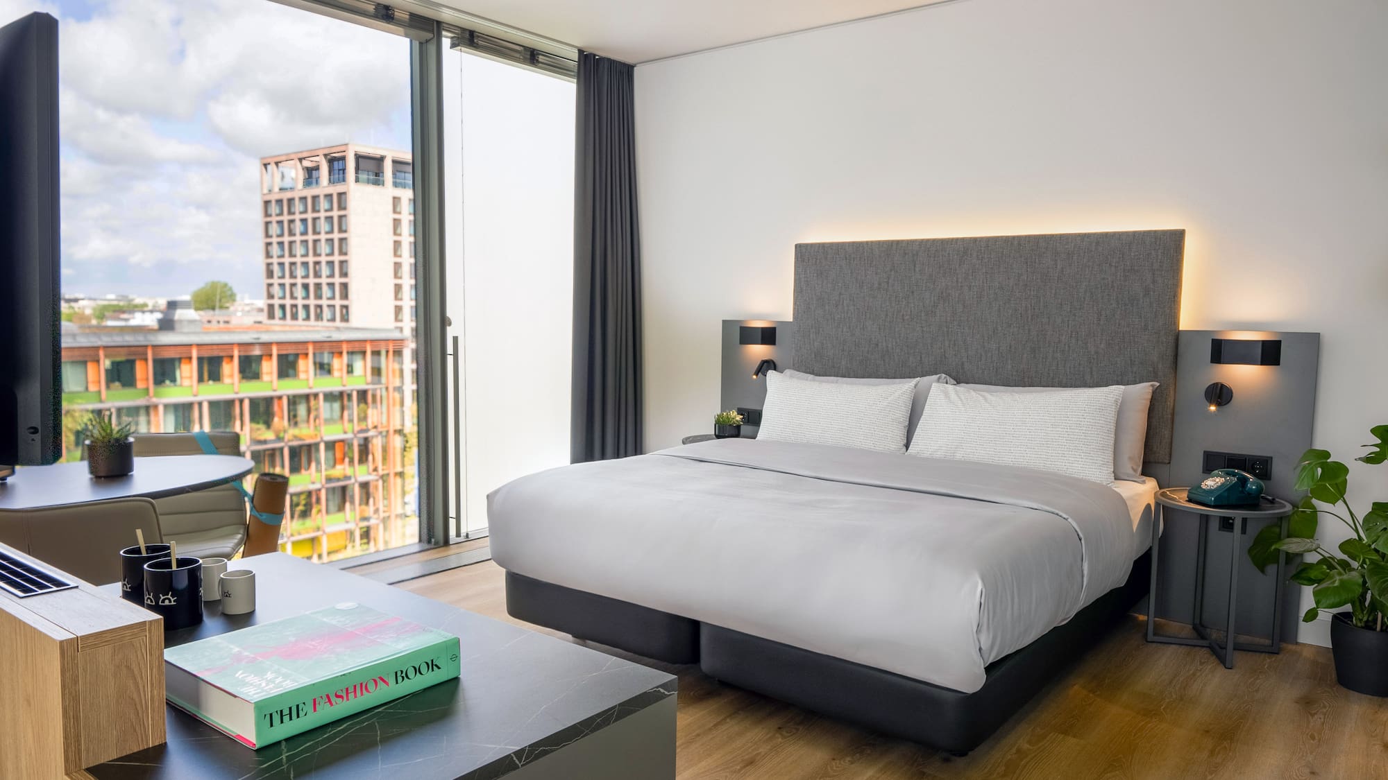 a bedroom with a large window