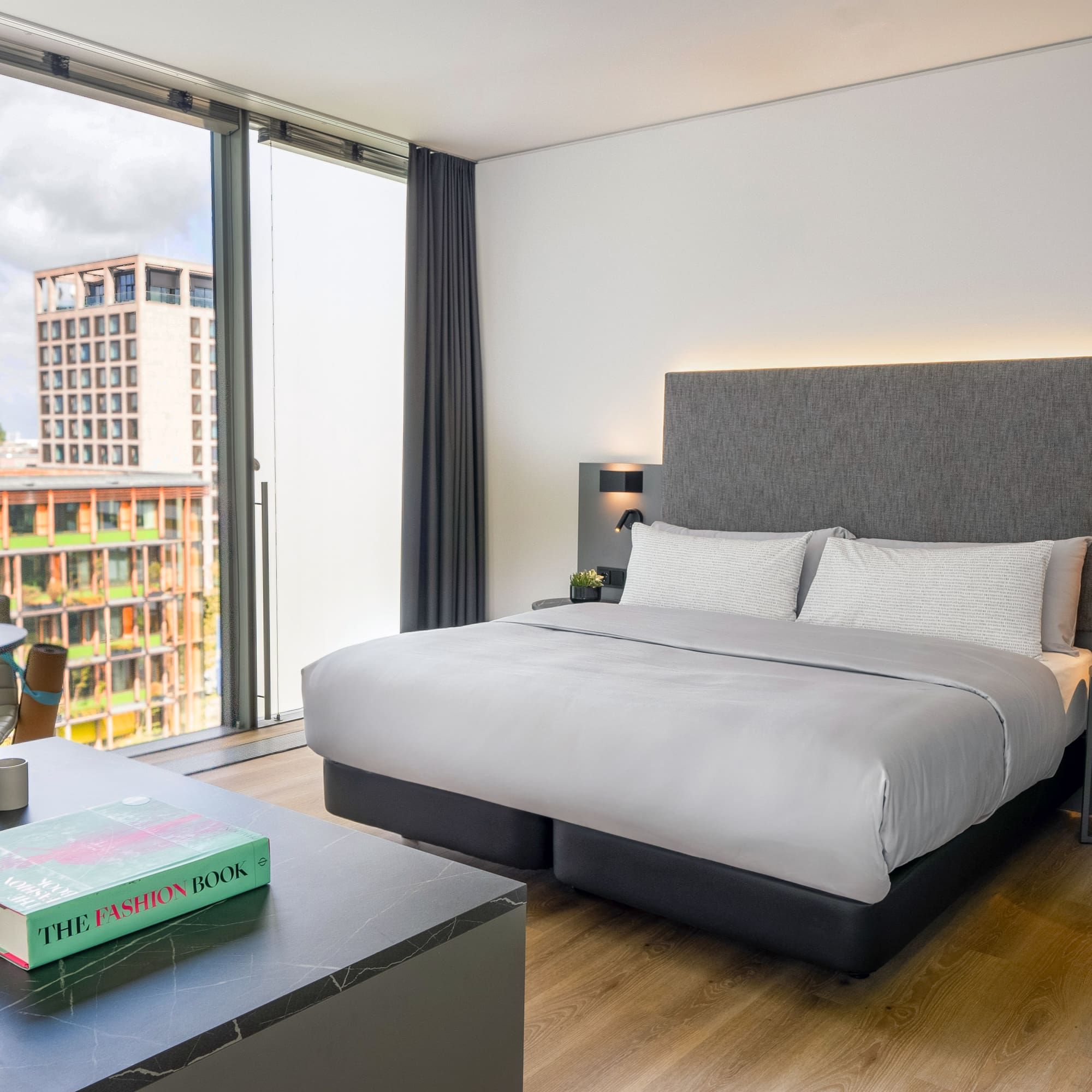 a bedroom with a large window