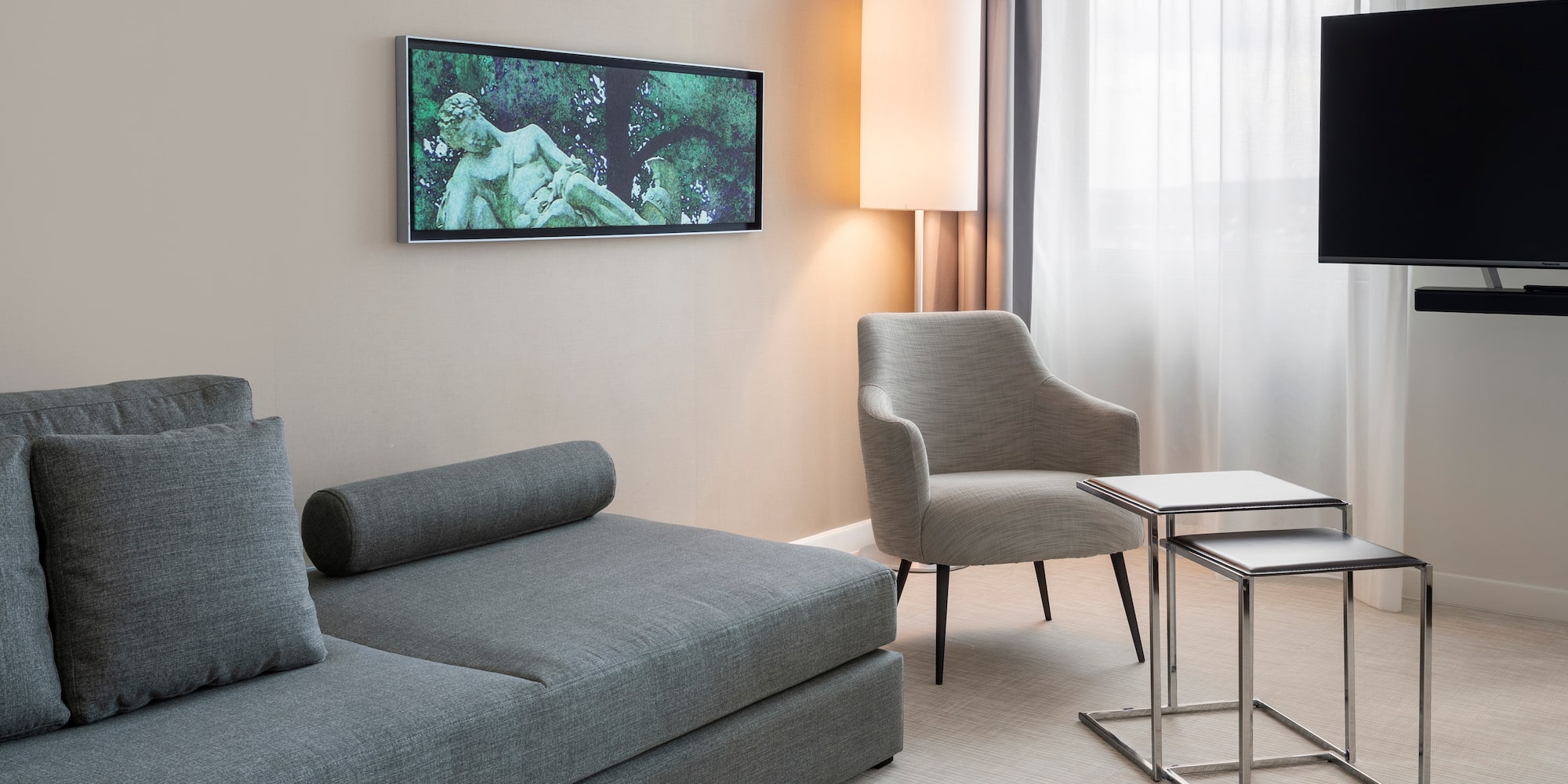 a living room with a couch and a tv