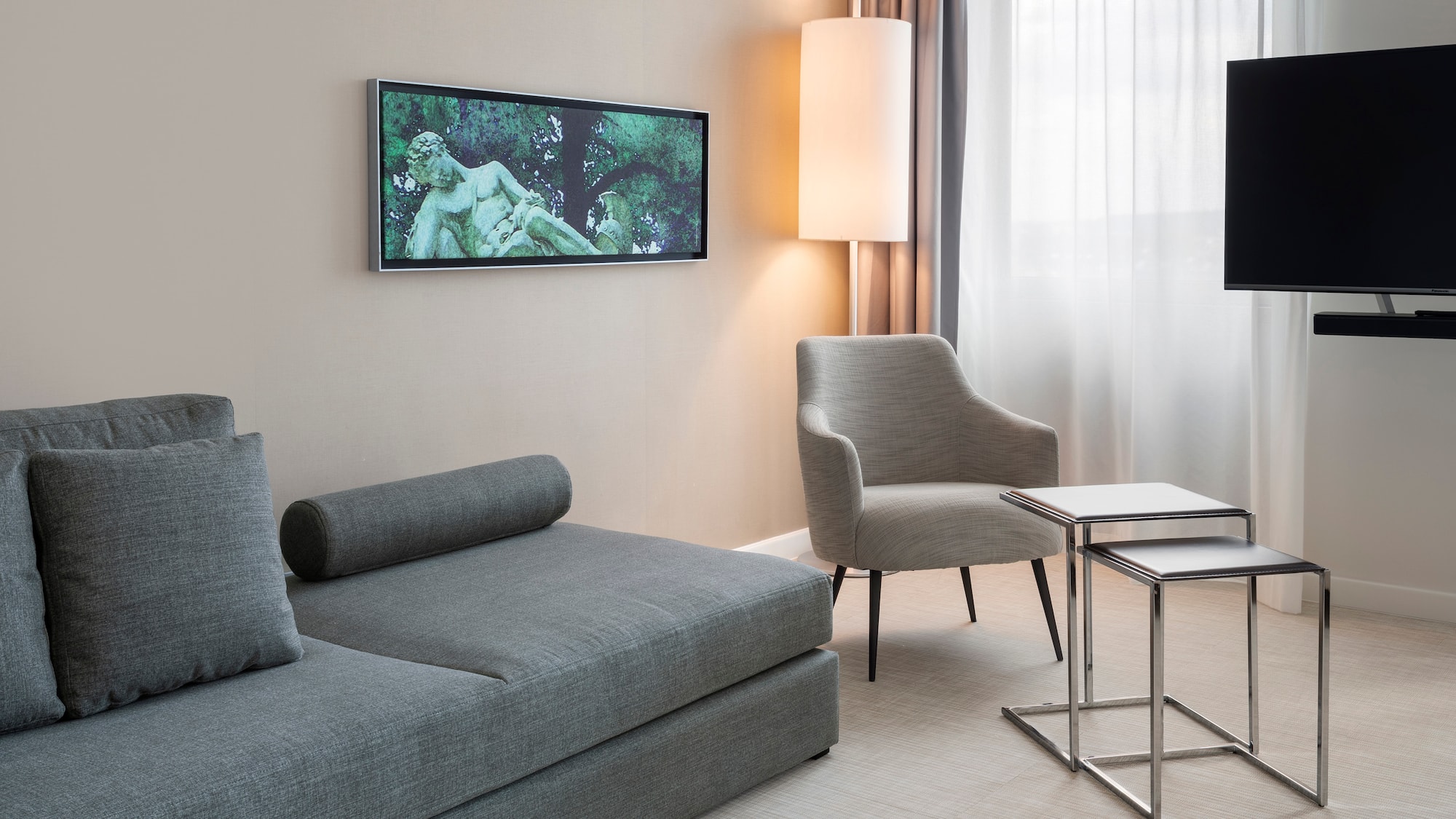 a living room with a couch and a tv