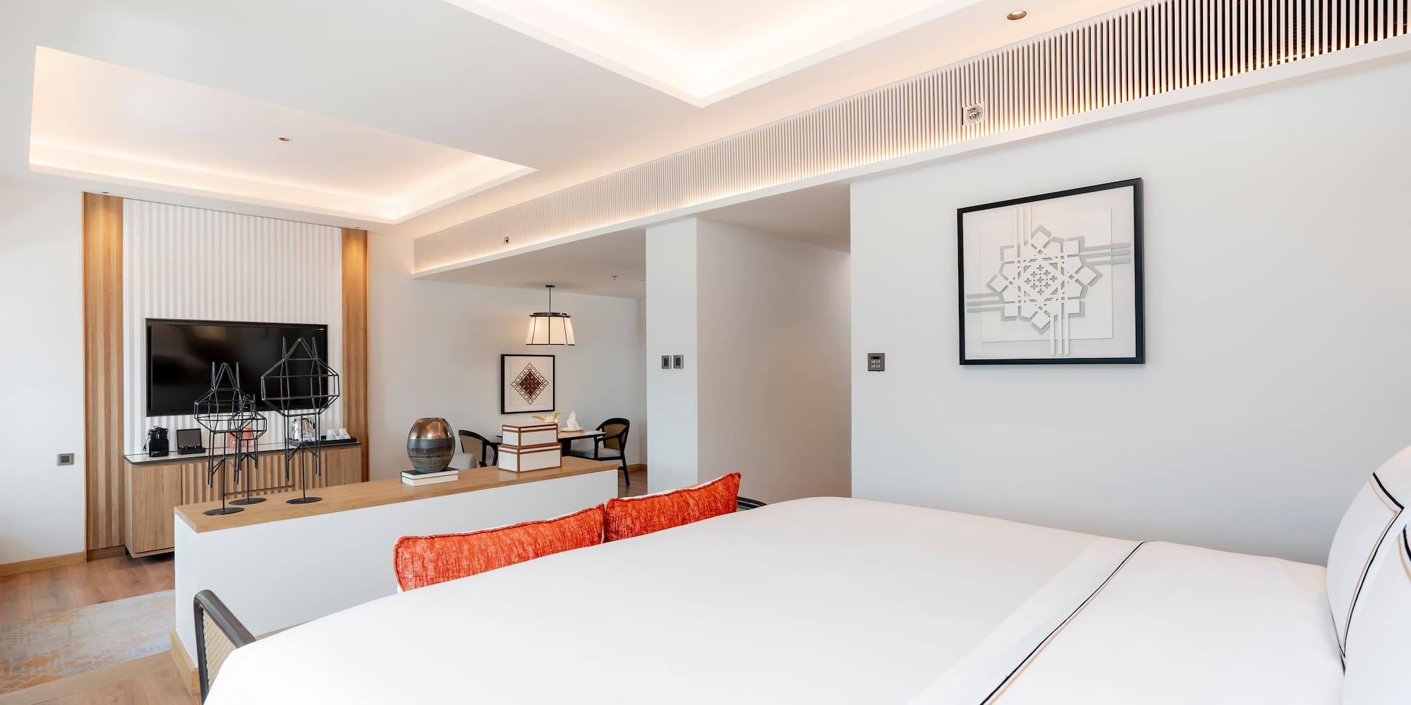 a room with a bed and a desk