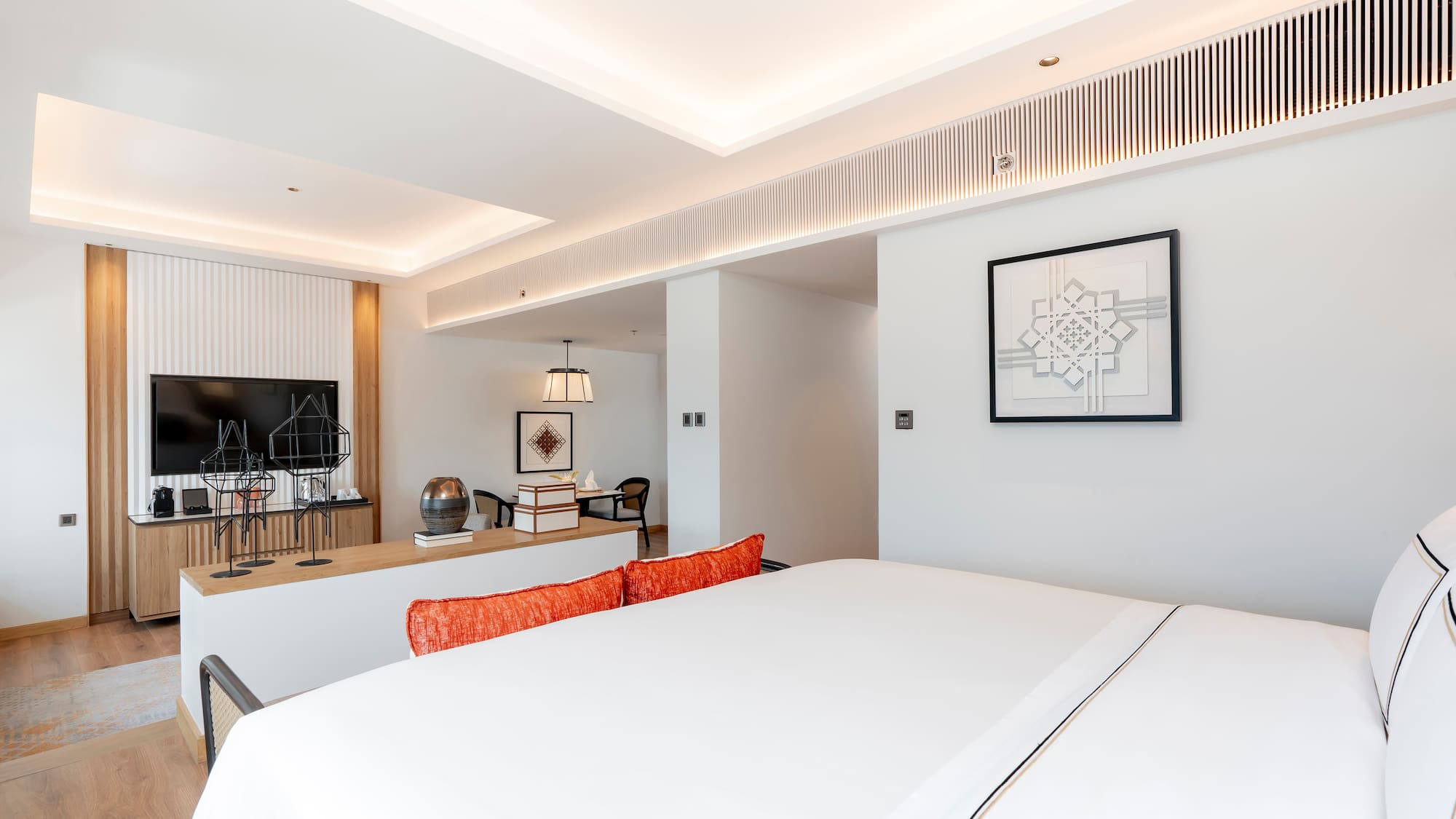 a room with a bed and a desk