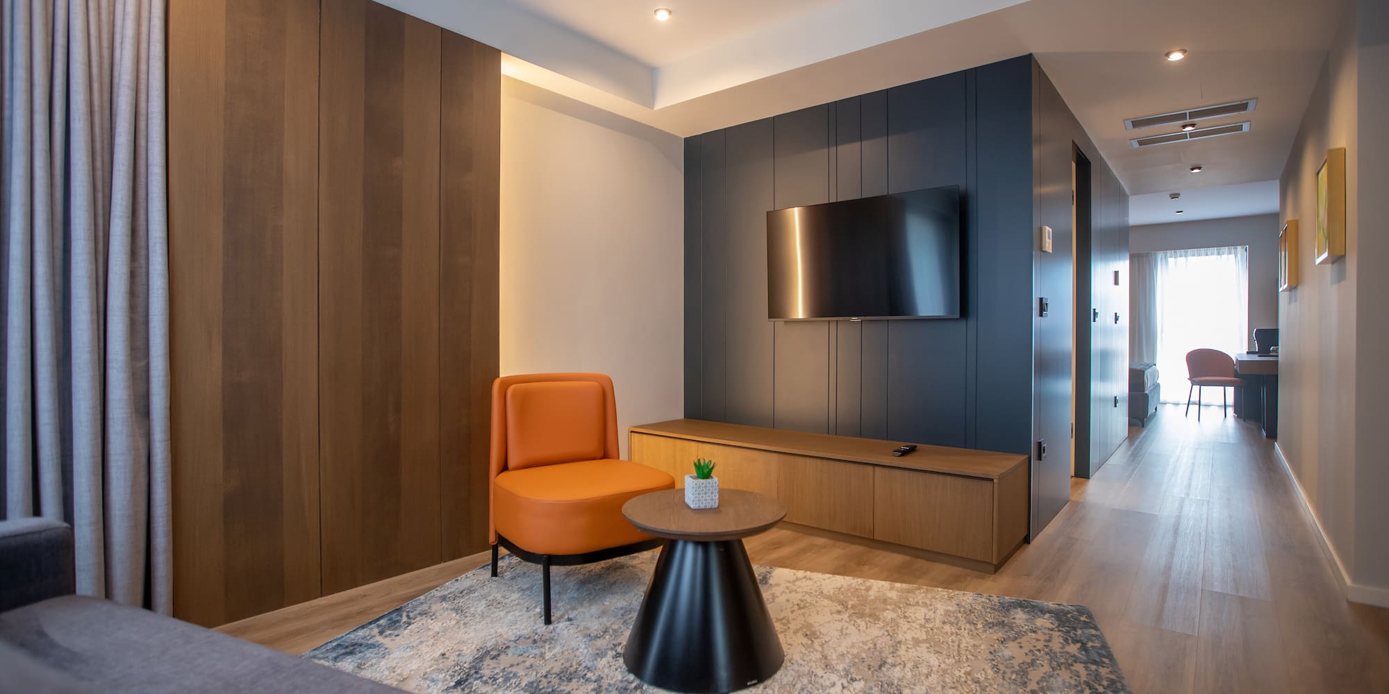 a room with a tv and a chair