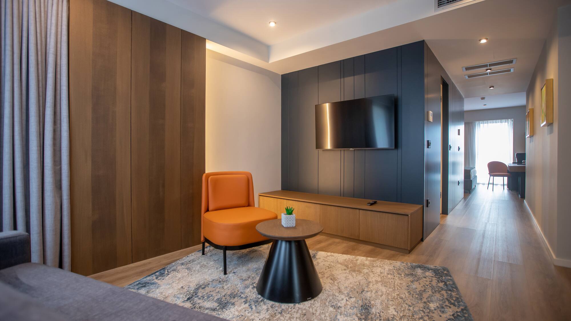 a room with a tv and a chair