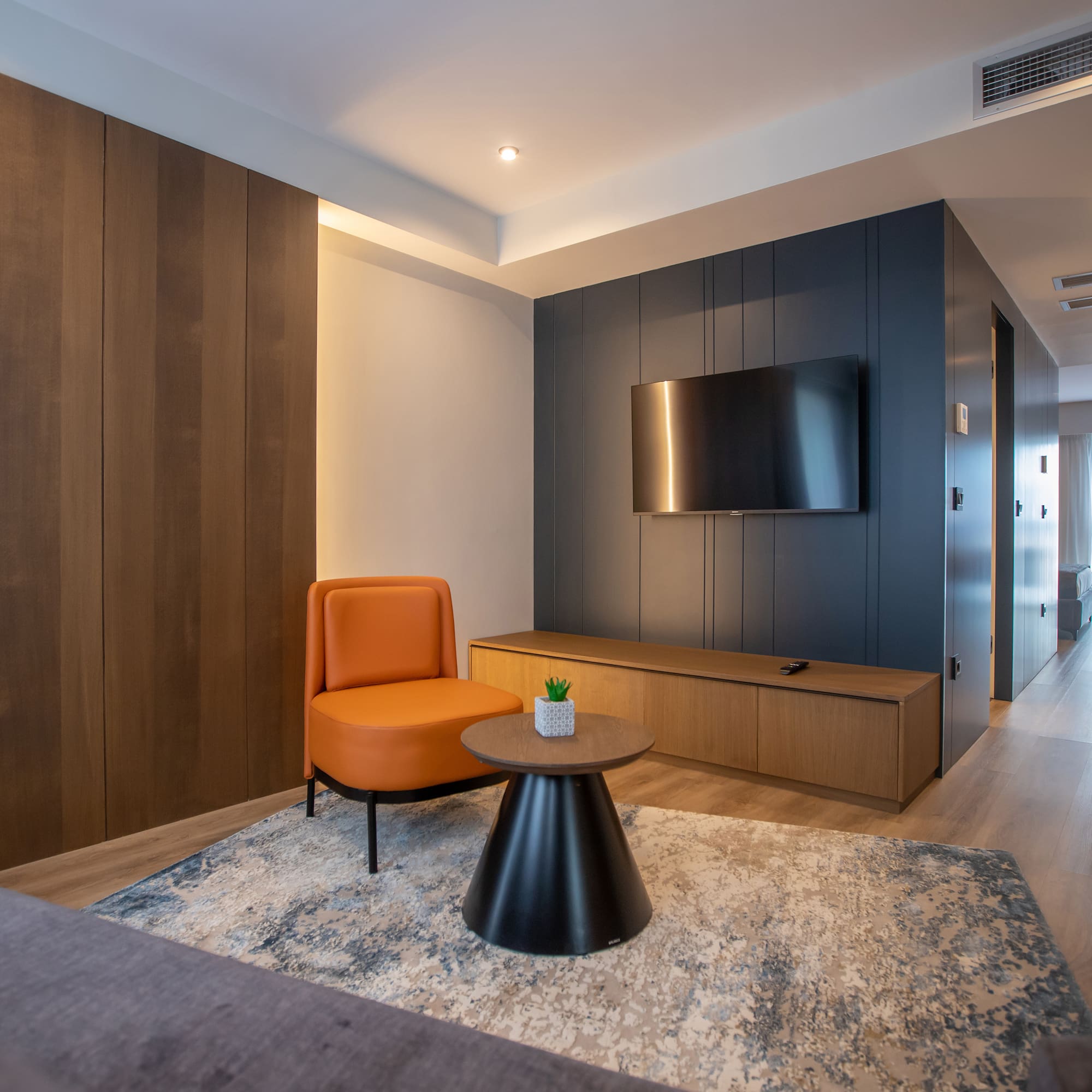 a room with a tv and a chair