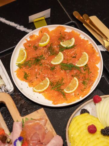 a plate of food with lemon slices on it