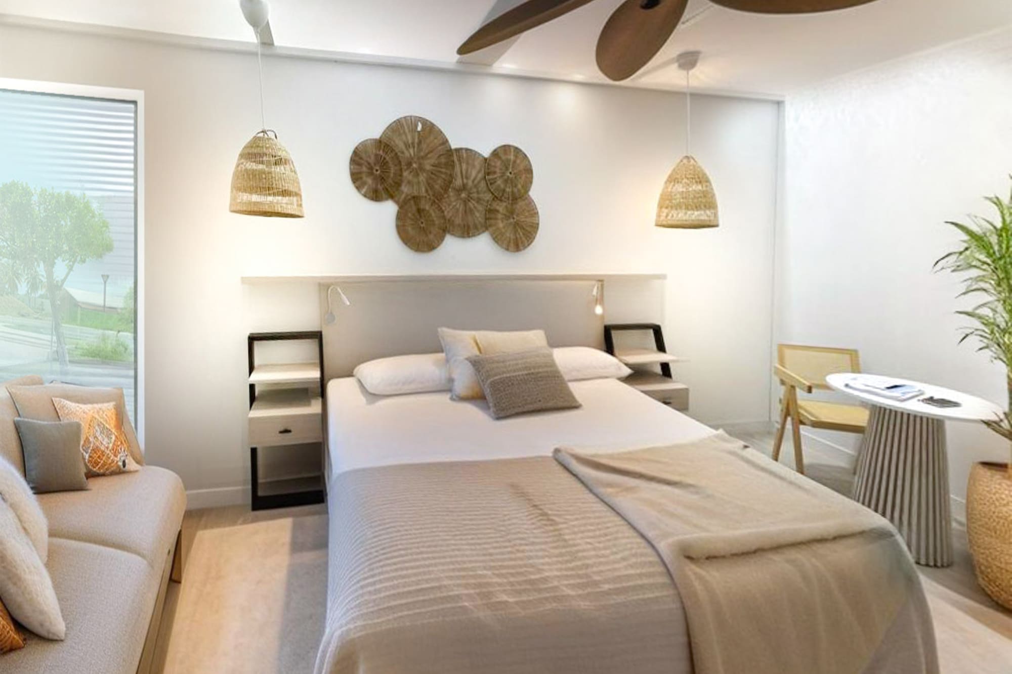 a room with a bed and a fan