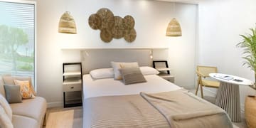 a room with a bed and a fan