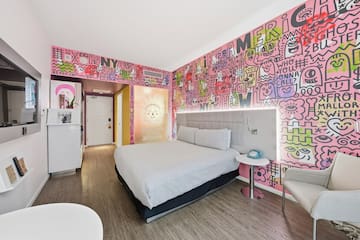 a room with a bed and a chair