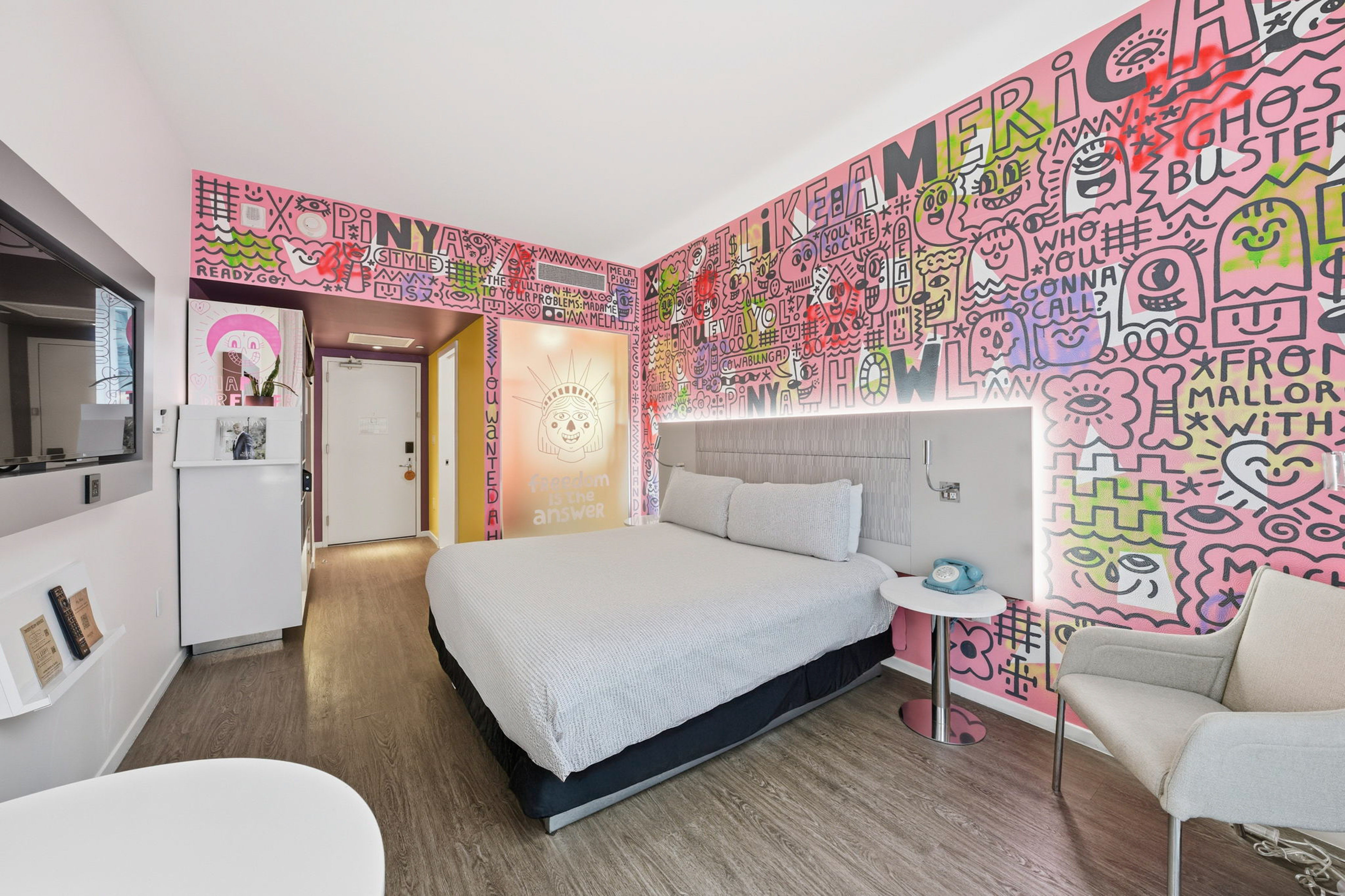 a room with a bed and a chair