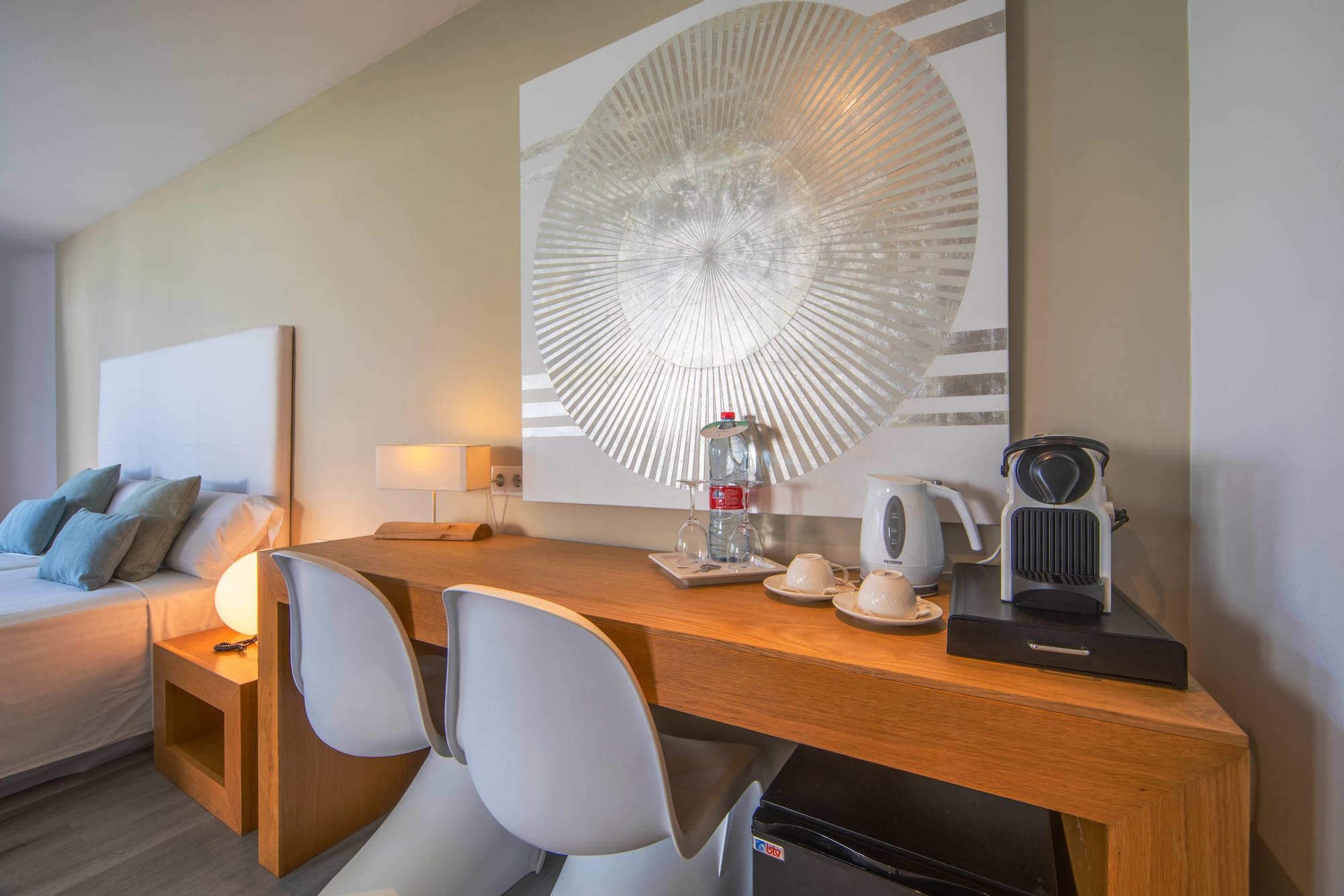 a table with chairs and a coffee maker